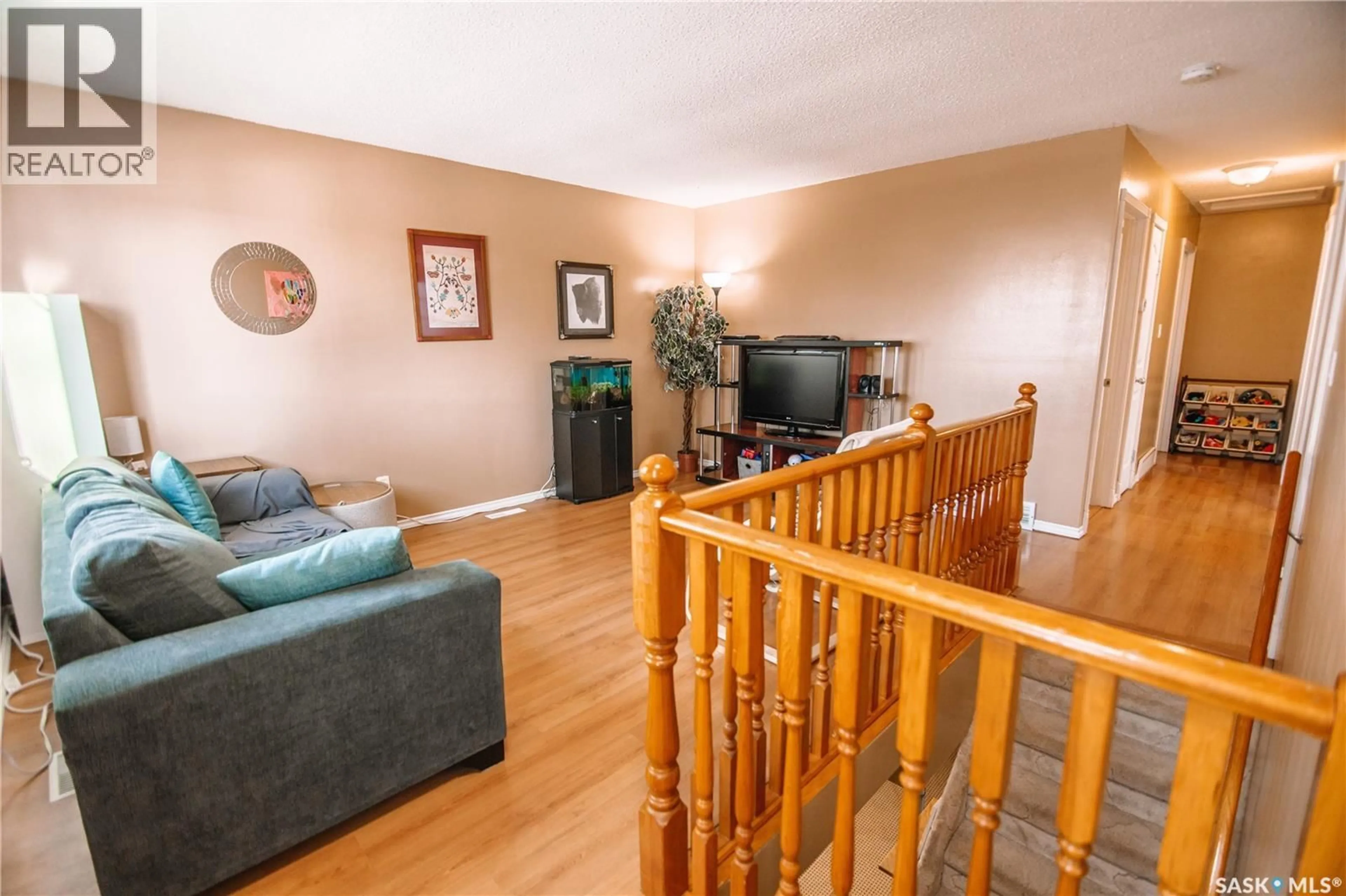 Living room with furniture, wood/laminate floor for 29 NATHAN STREET, Regina Saskatchewan S4R4Z3