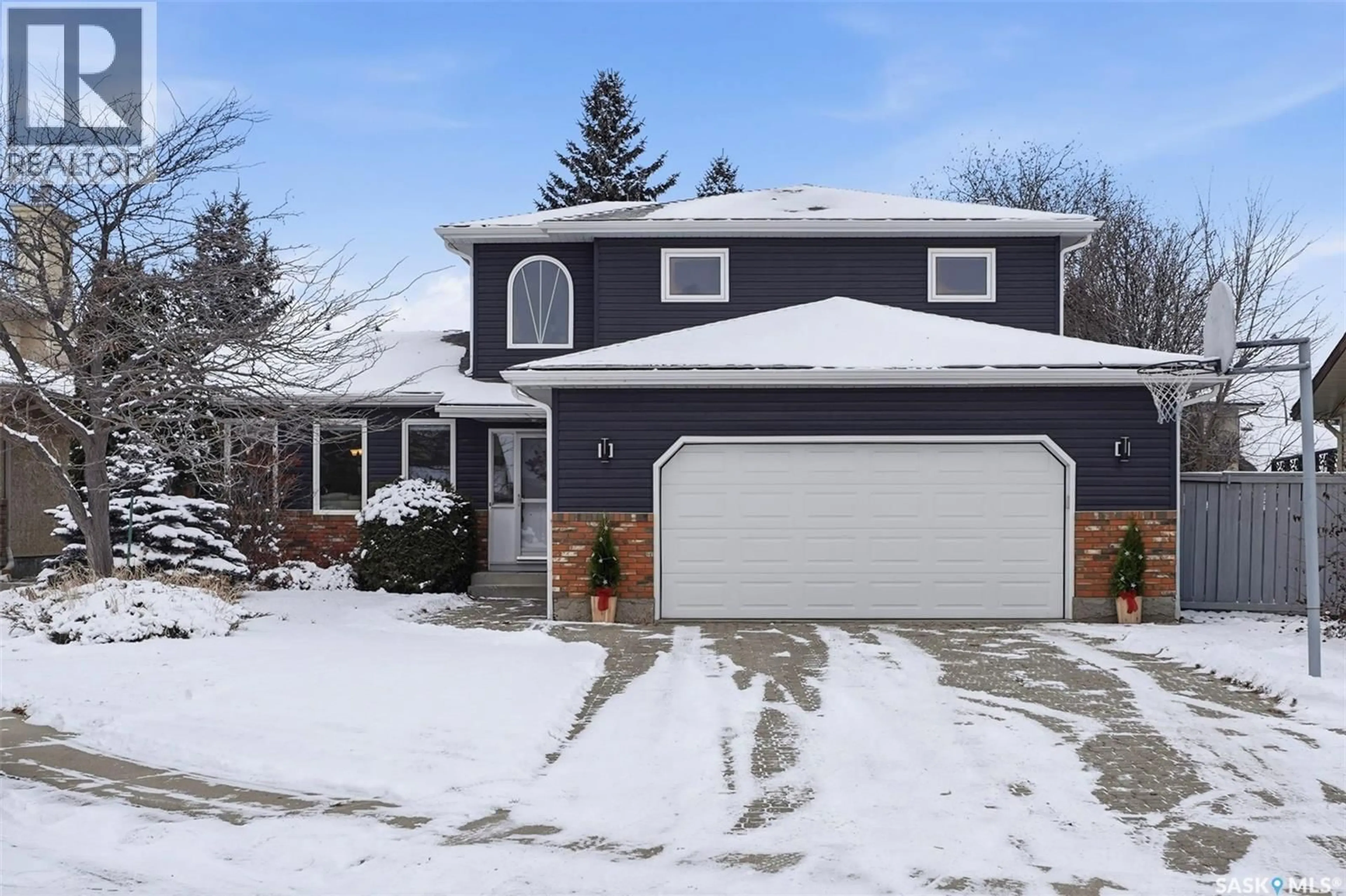 Home with vinyl exterior material, street for 935 EMMELINE TERRACE, Saskatoon Saskatchewan S7J5G7