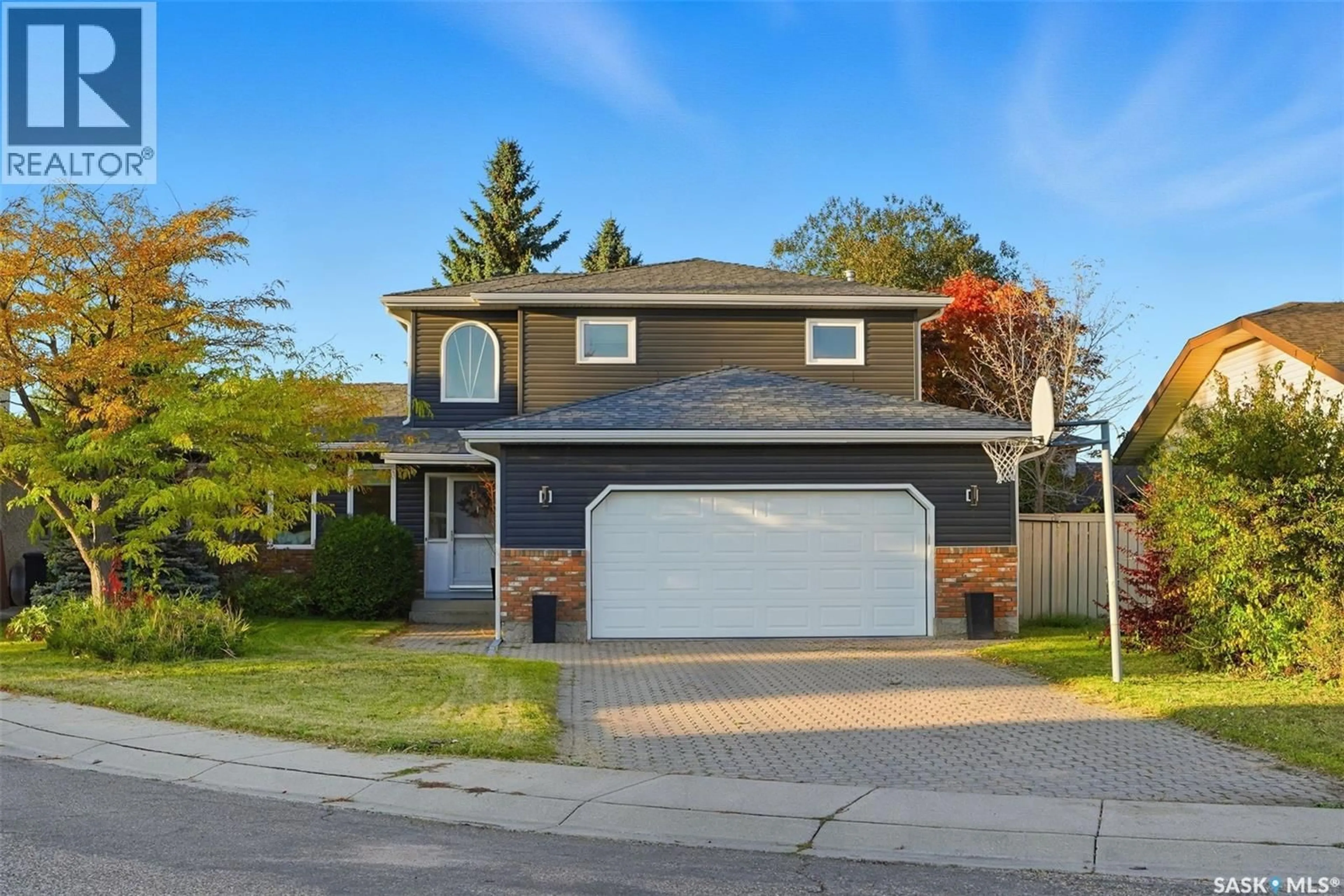 Home with vinyl exterior material, street for 935 EMMELINE TERRACE, Saskatoon Saskatchewan S7J5G7