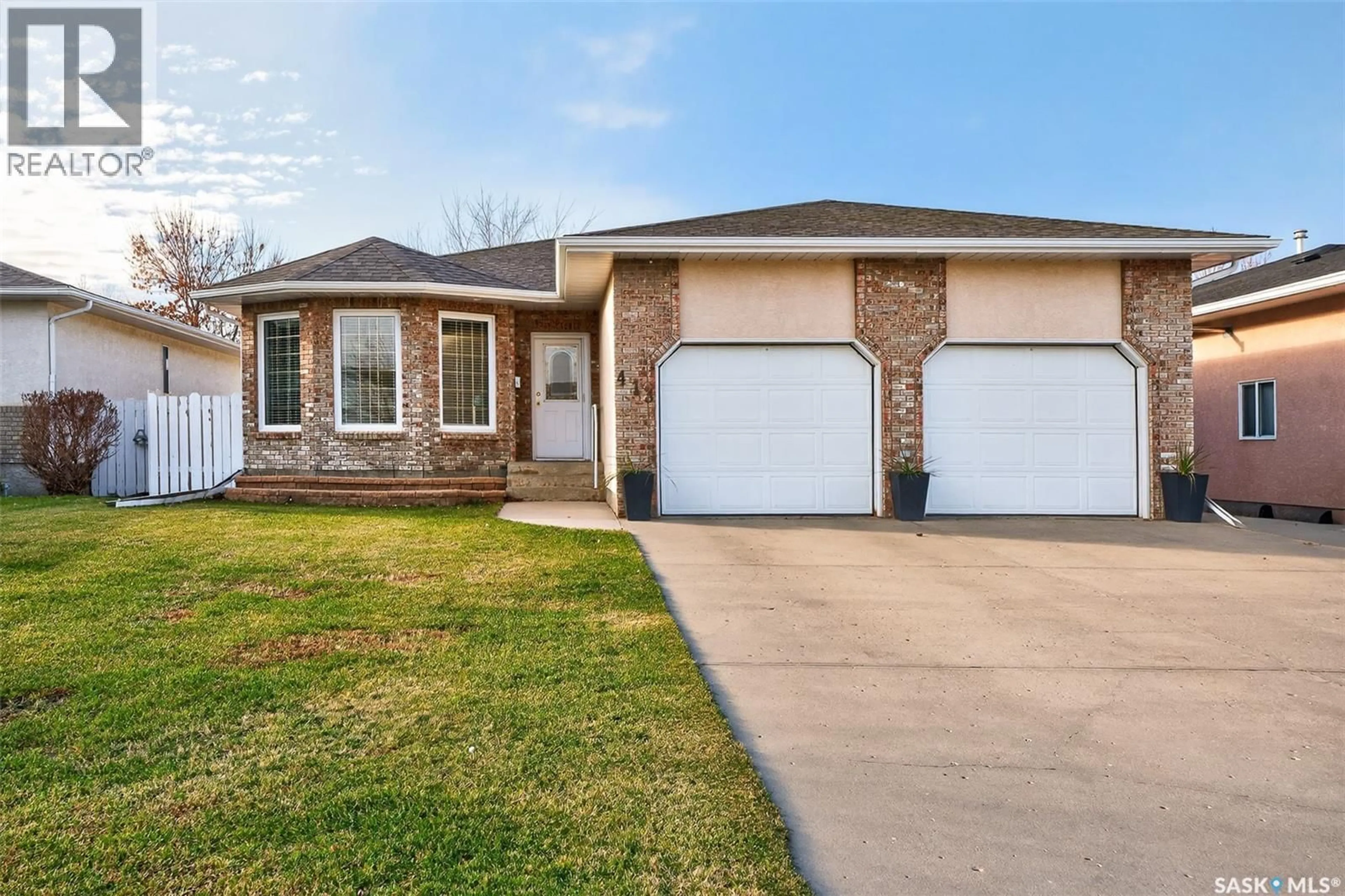 Home with brick exterior material, street for 413 WOODLILY DRIVE, Moose Jaw Saskatchewan S6J1K4