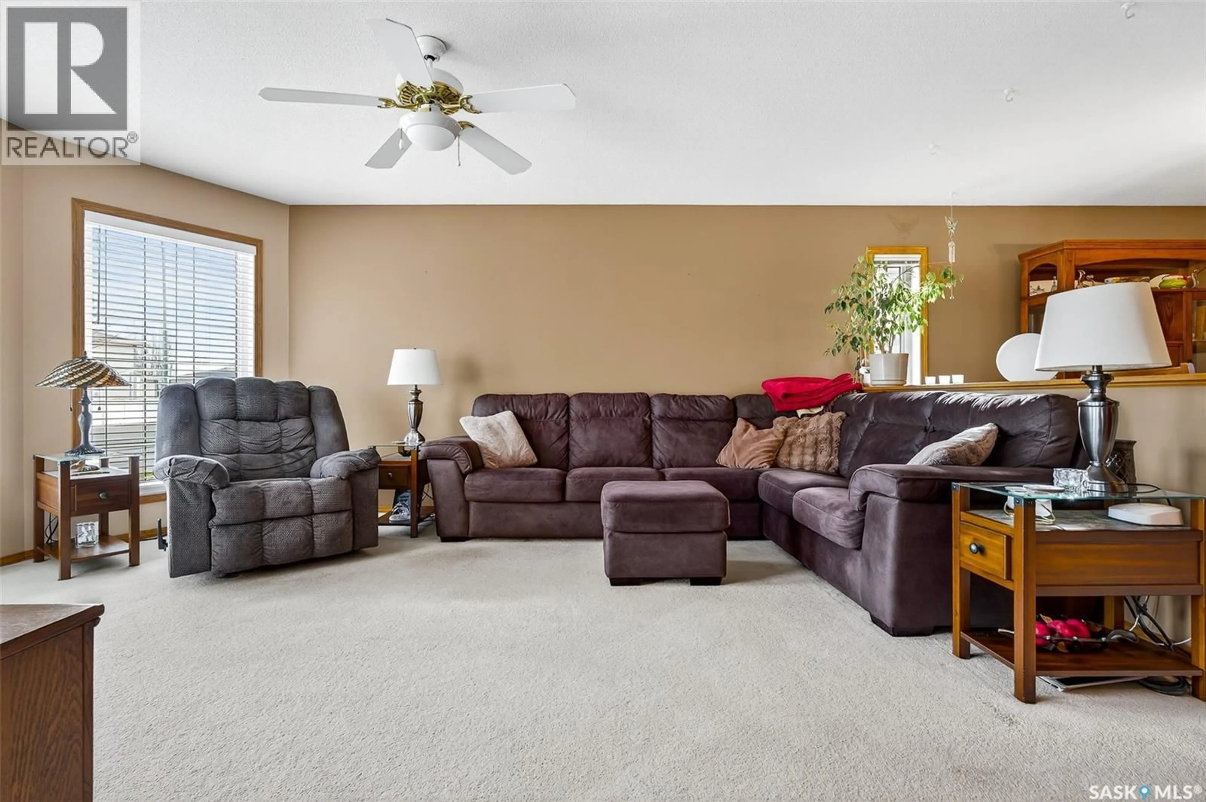 Living room with furniture, carpet floor for 413 WOODLILY DRIVE, Moose Jaw Saskatchewan S6J1K4