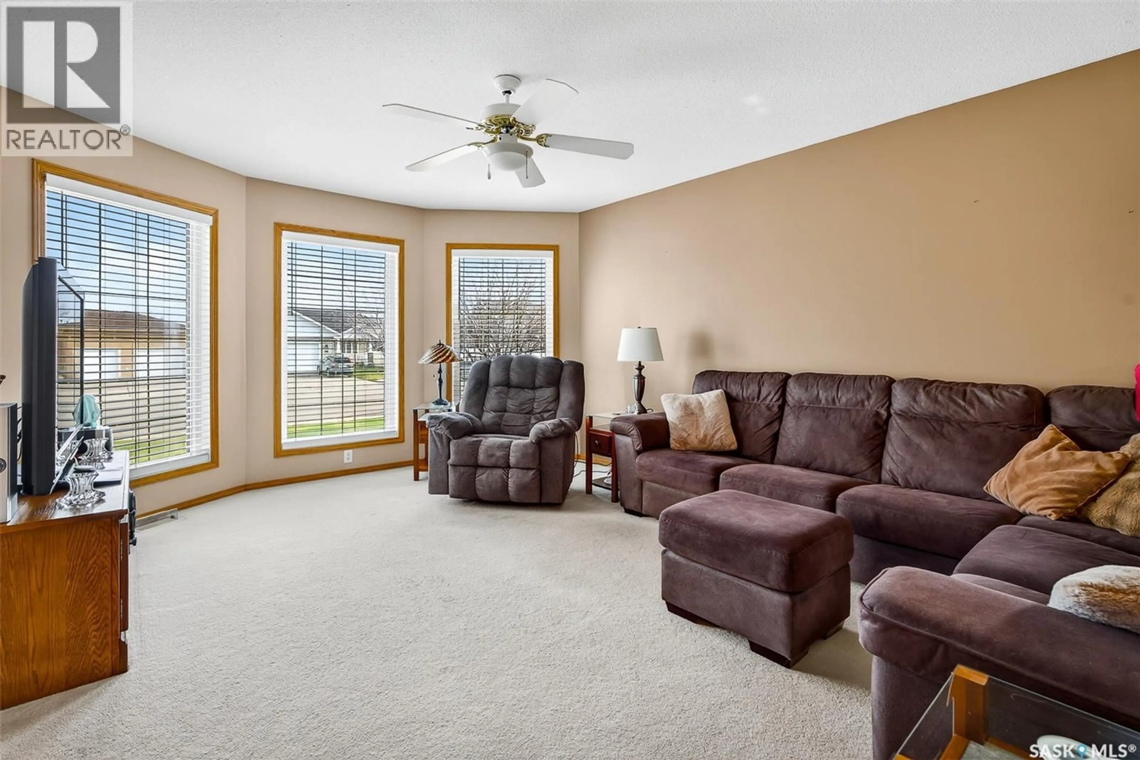Living room with furniture, ceramic/tile floor for 413 WOODLILY DRIVE, Moose Jaw Saskatchewan S6J1K4