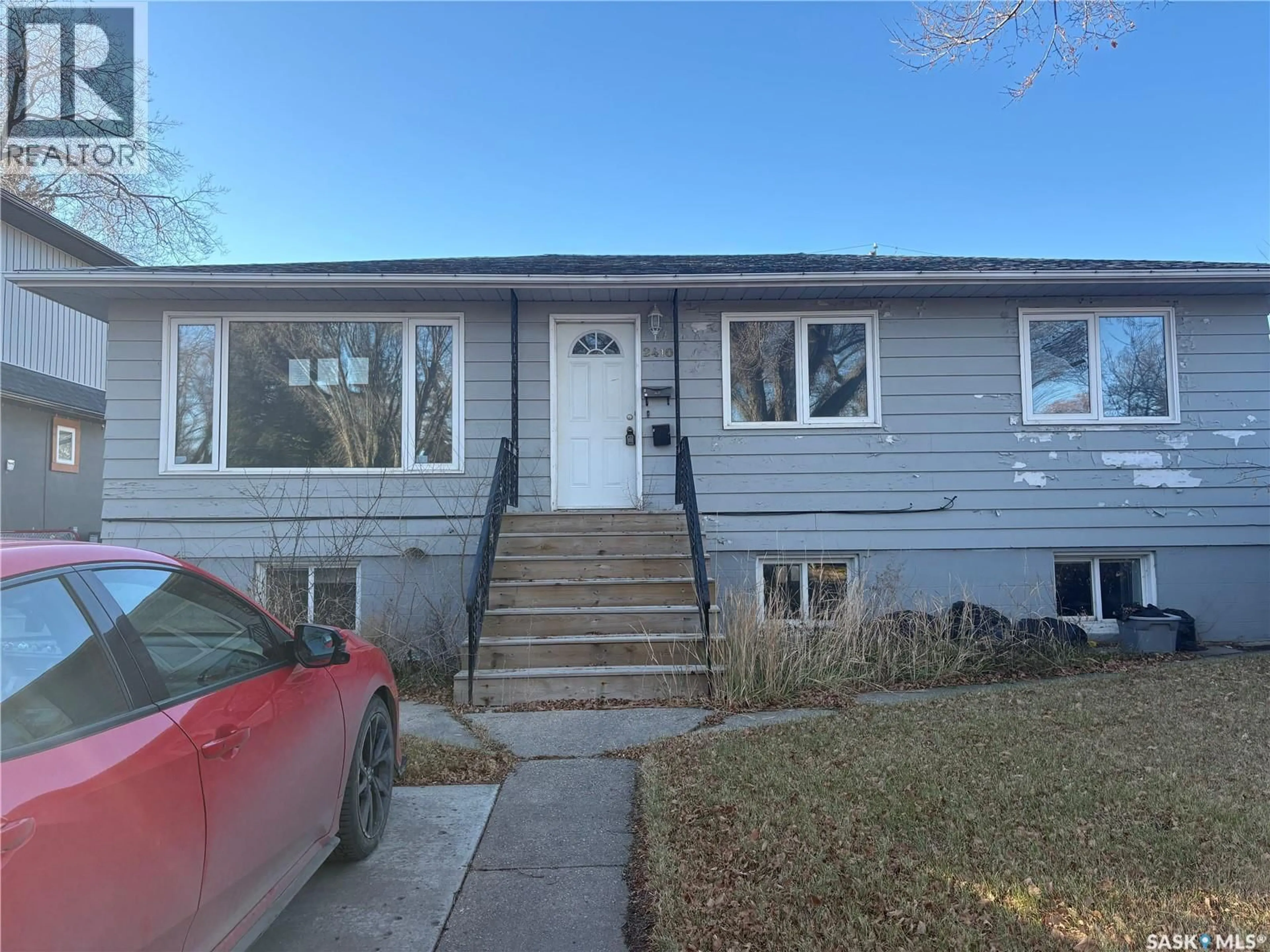 Home with vinyl exterior material, street for 2410 MELROSE AVENUE, Saskatoon Saskatchewan S7J0V5