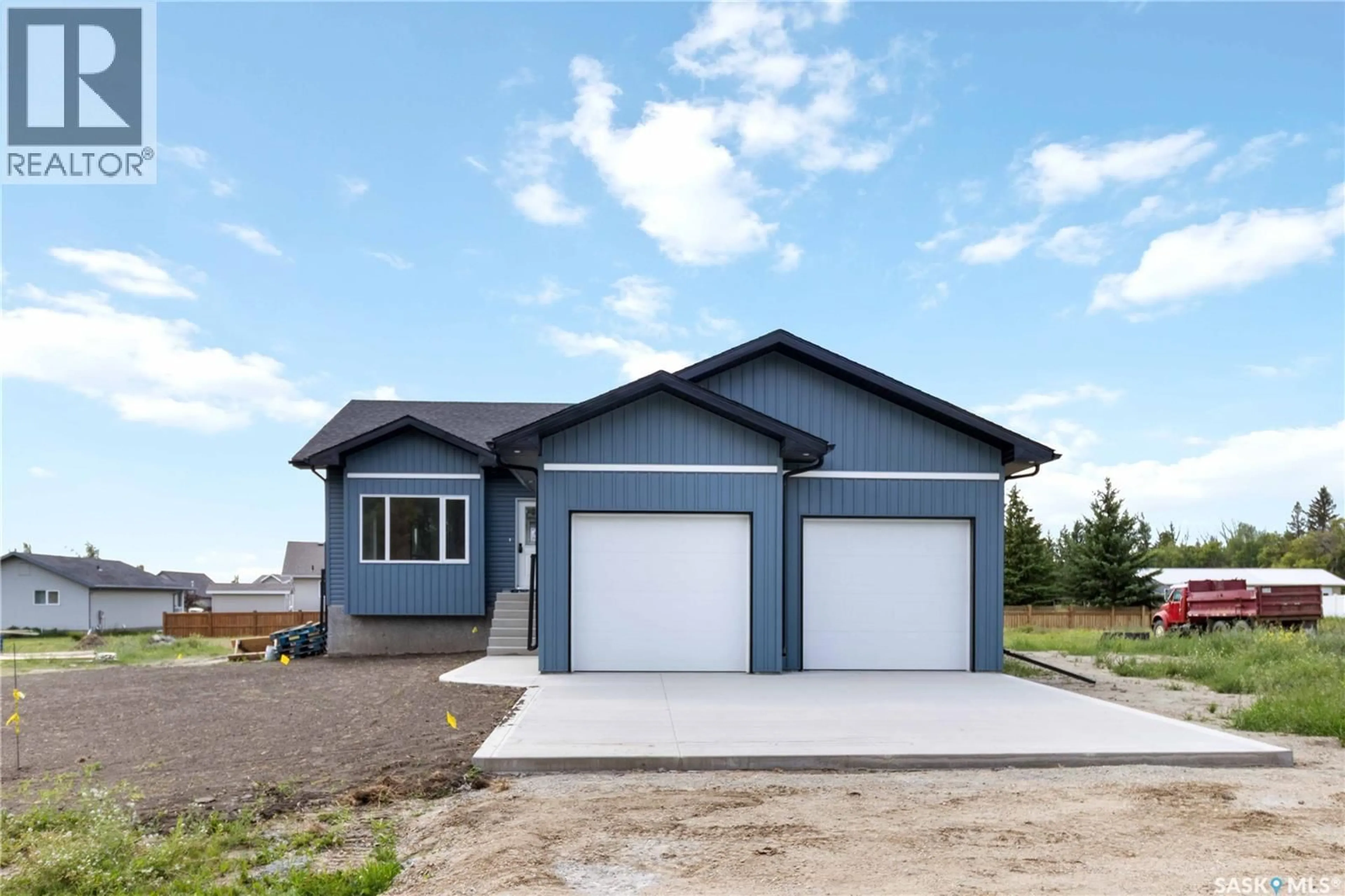 Home with vinyl exterior material, street for 210 2ND STREET, Waldheim Saskatchewan S0K4R0