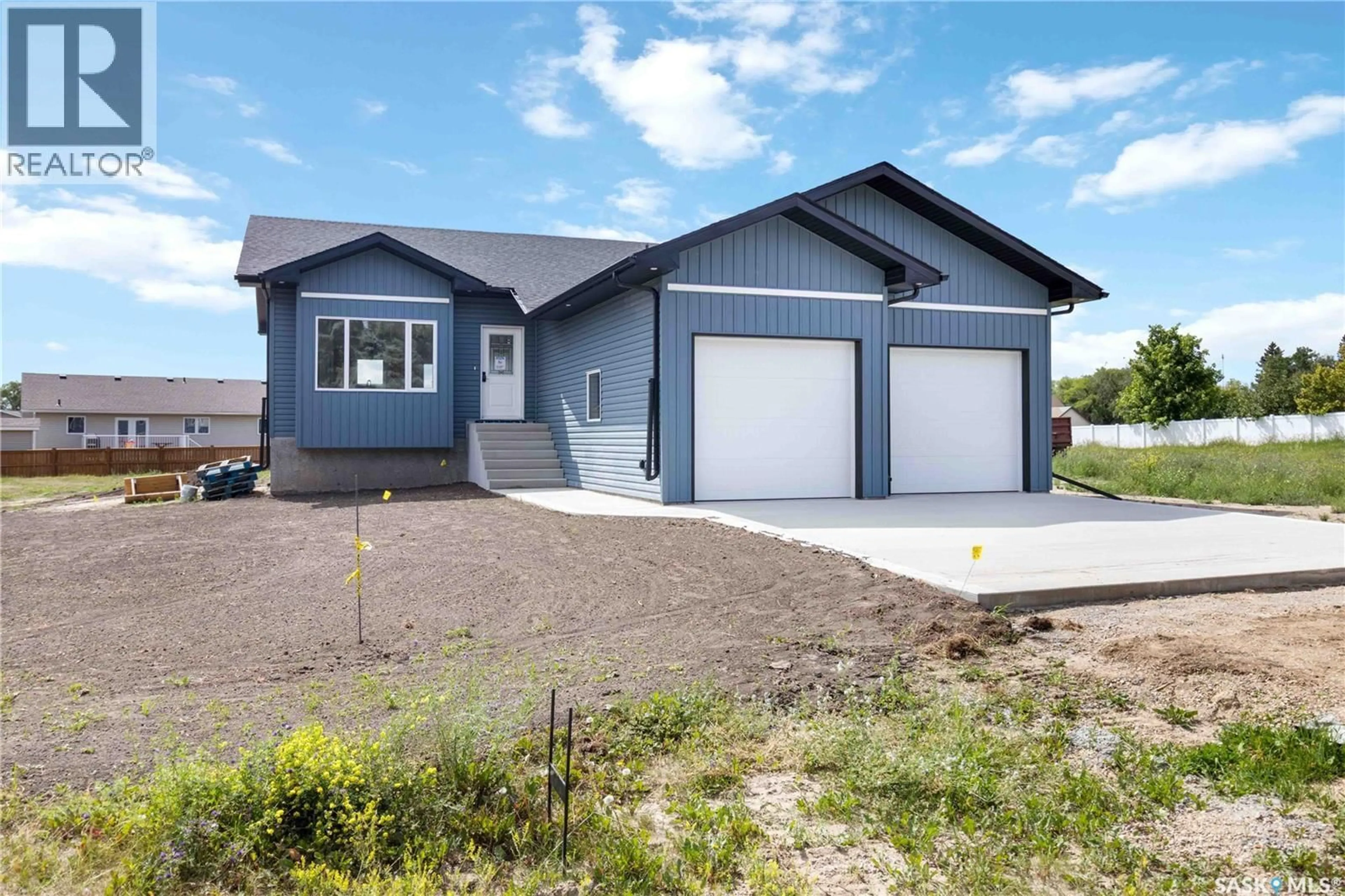 Home with vinyl exterior material, street for 210 2ND STREET, Waldheim Saskatchewan S0K4R0