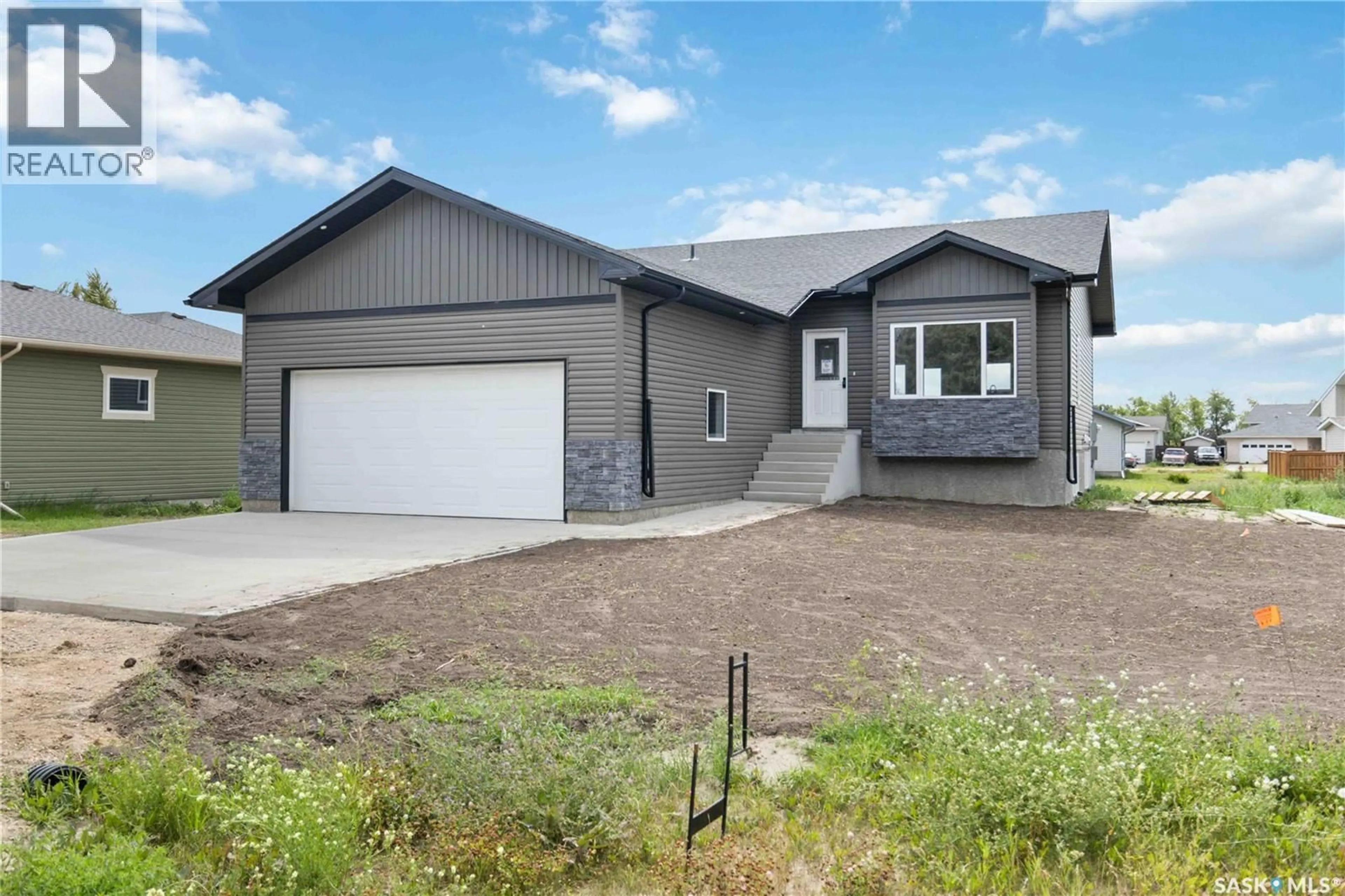 Home with vinyl exterior material, street for 208 2ND STREET, Waldheim Saskatchewan S0K4R0