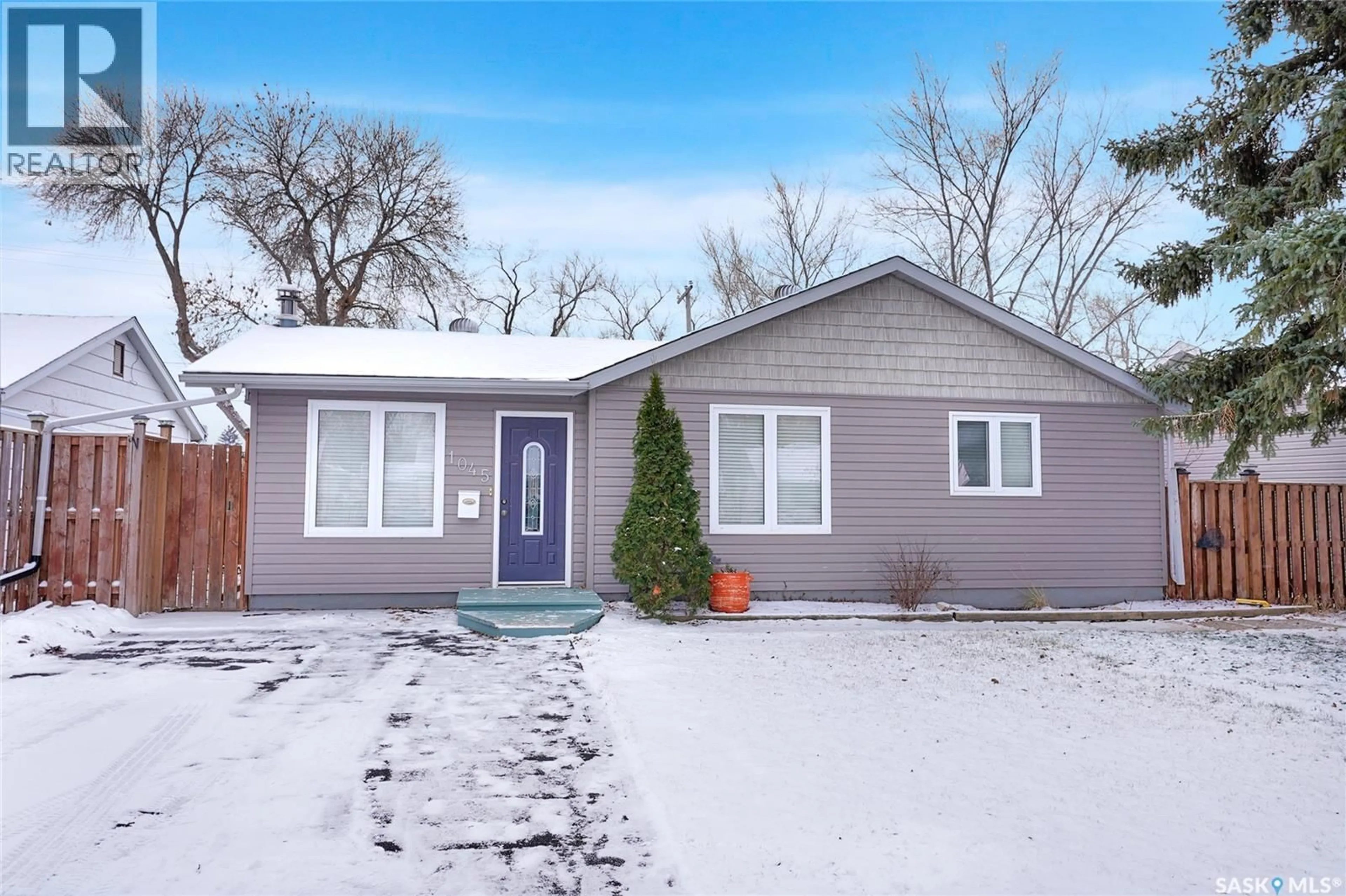 Home with vinyl exterior material, street for 1045 BROWN STREET, Moose Jaw Saskatchewan S6H2Z4