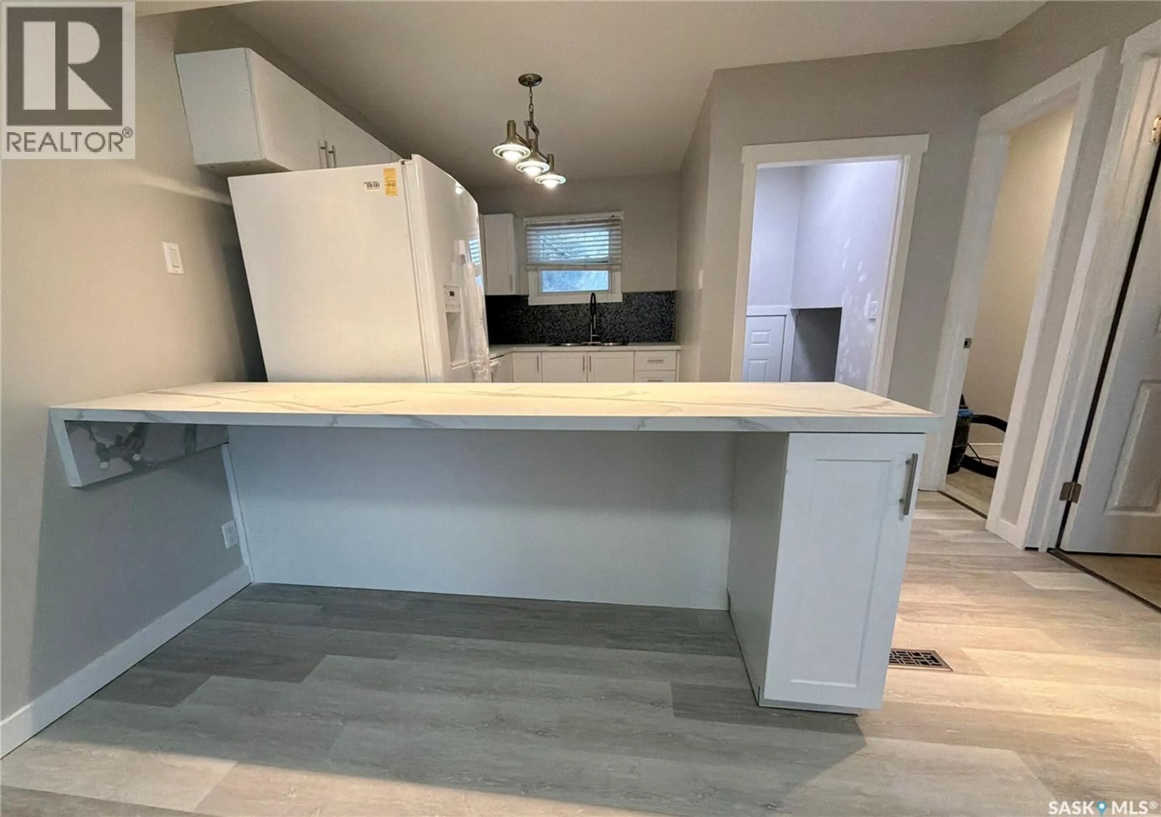 Open concept kitchen, ceramic/tile floor for 5120 DEWDNEY AVENUE, Regina Saskatchewan S4T1C1