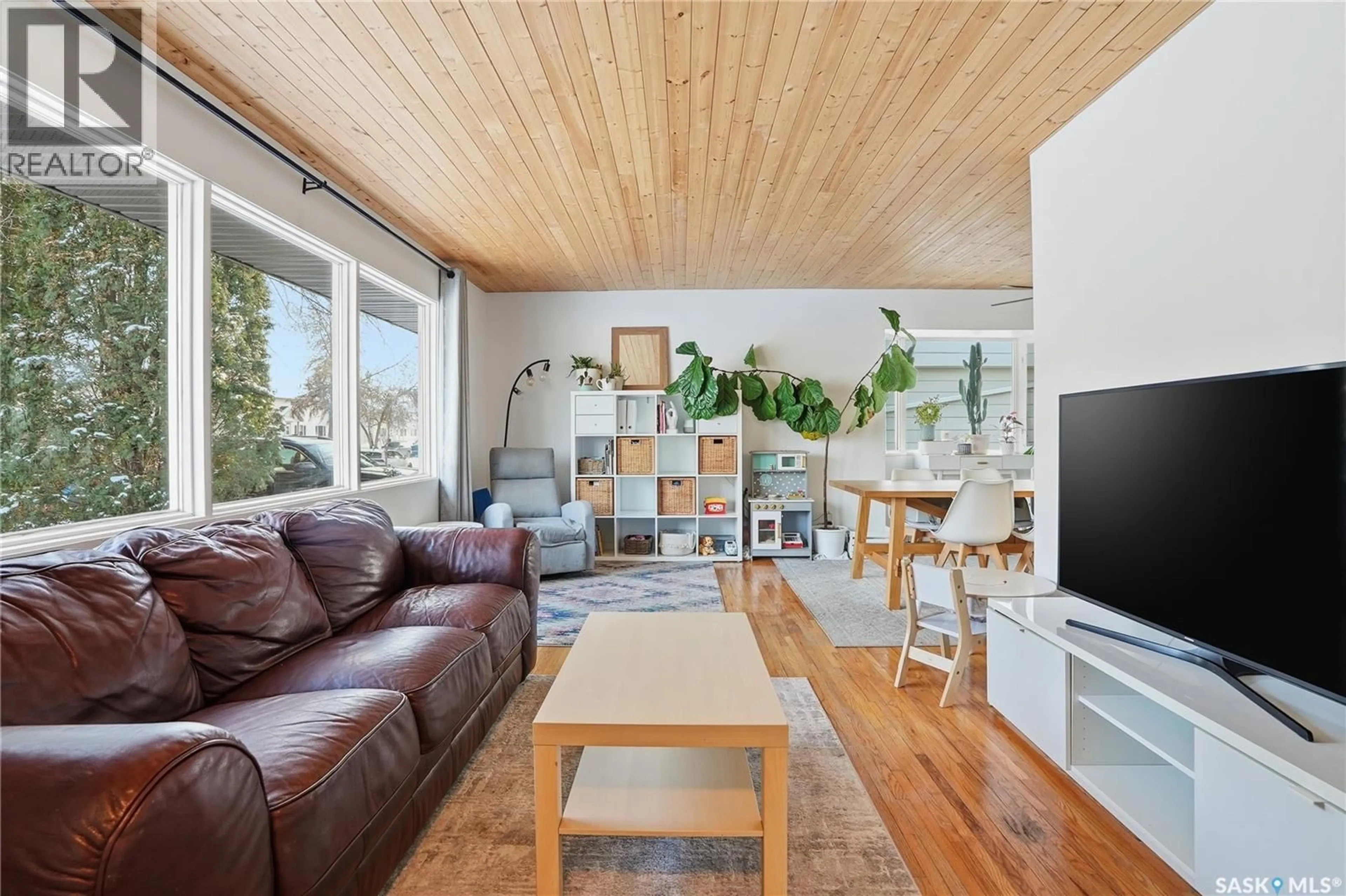 Living room with furniture, wood/laminate floor for 2210 WILLIAM AVENUE, Saskatoon Saskatchewan S7J1A6