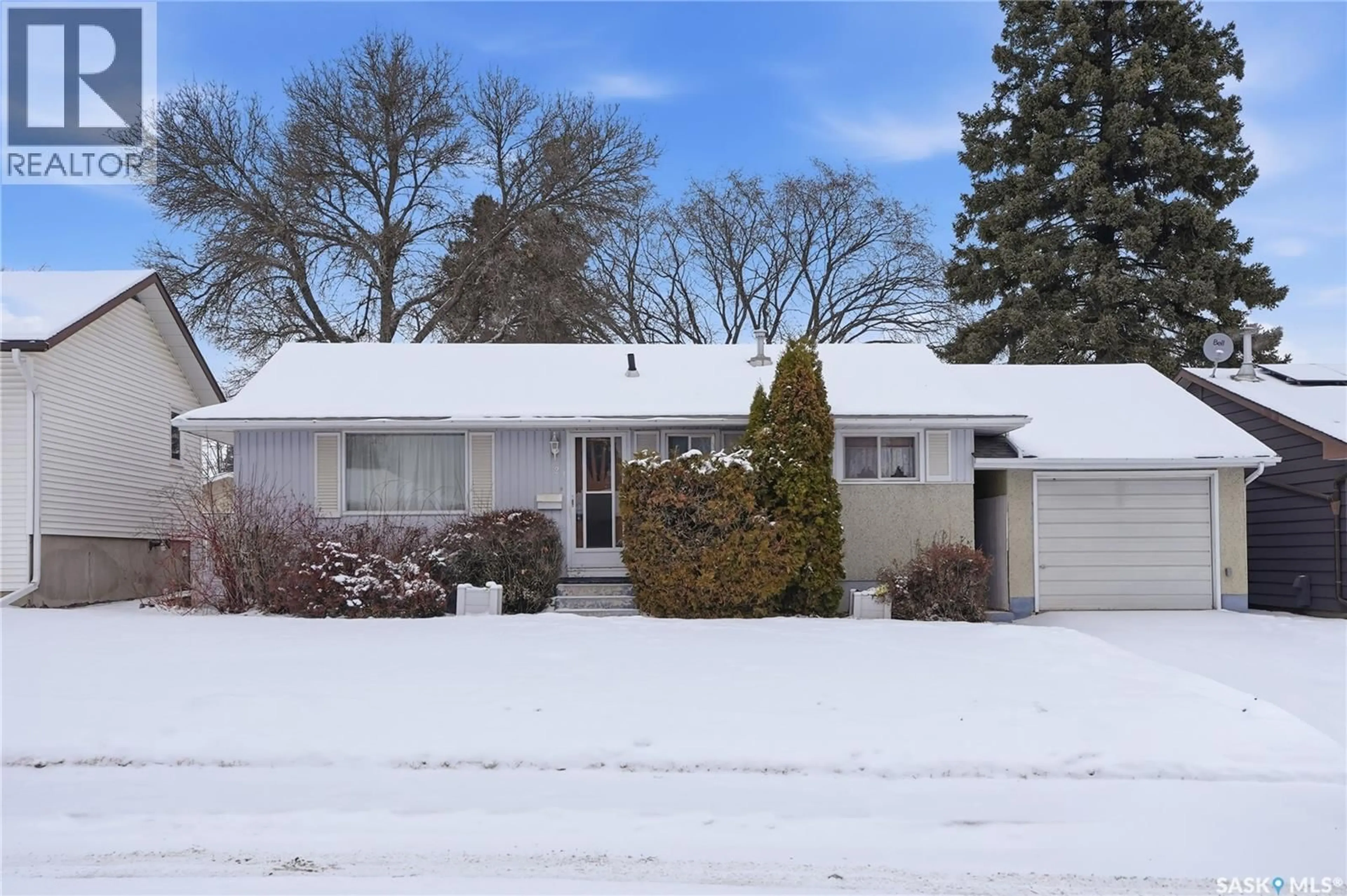 Home with vinyl exterior material, street for 23 JOHN EAST AVENUE, Saskatoon Saskatchewan S7L3S3