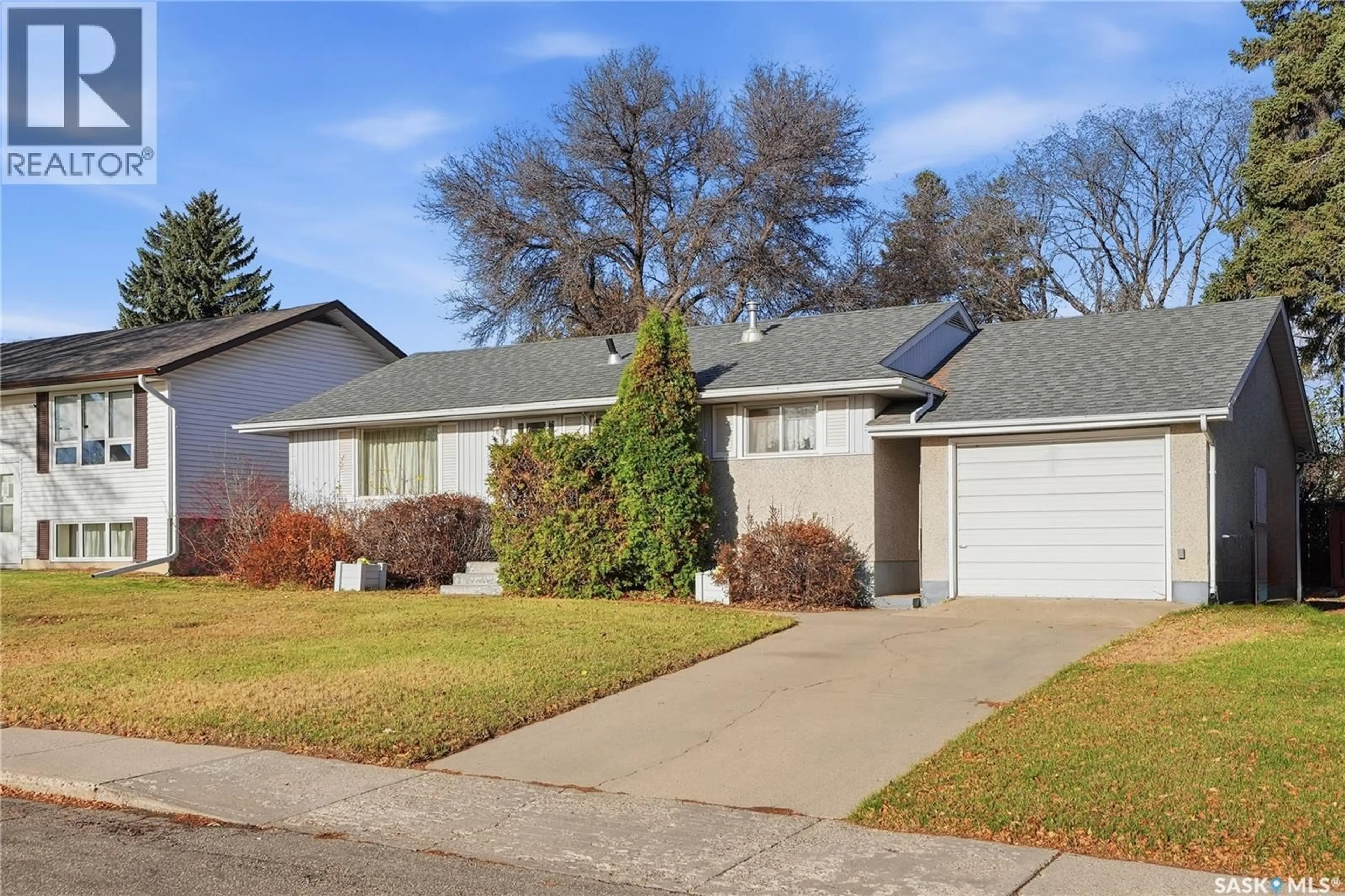 Home with vinyl exterior material, street for 23 JOHN EAST AVENUE, Saskatoon Saskatchewan S7L3S3