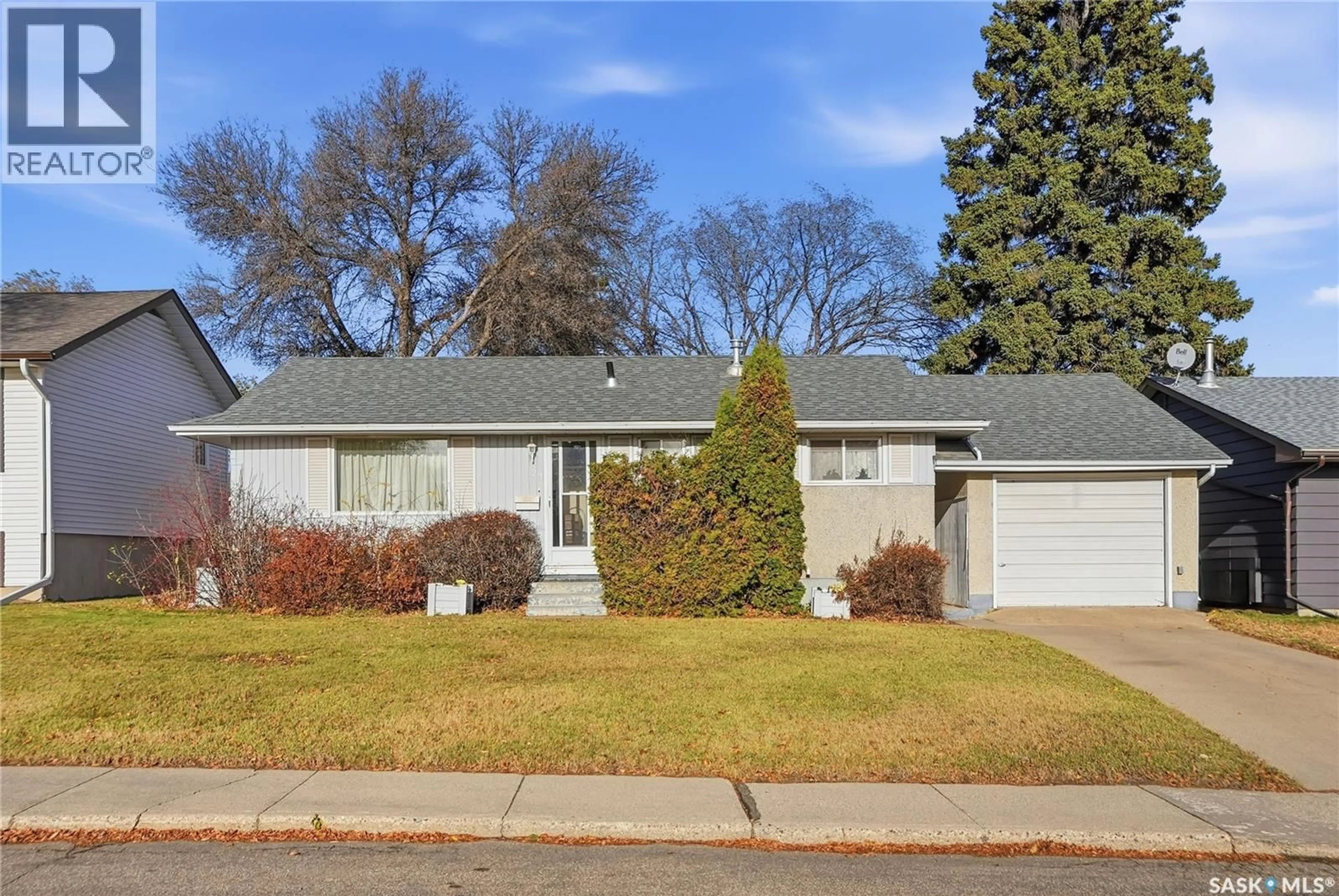 Home with vinyl exterior material, street for 23 JOHN EAST AVENUE, Saskatoon Saskatchewan S7L3S3