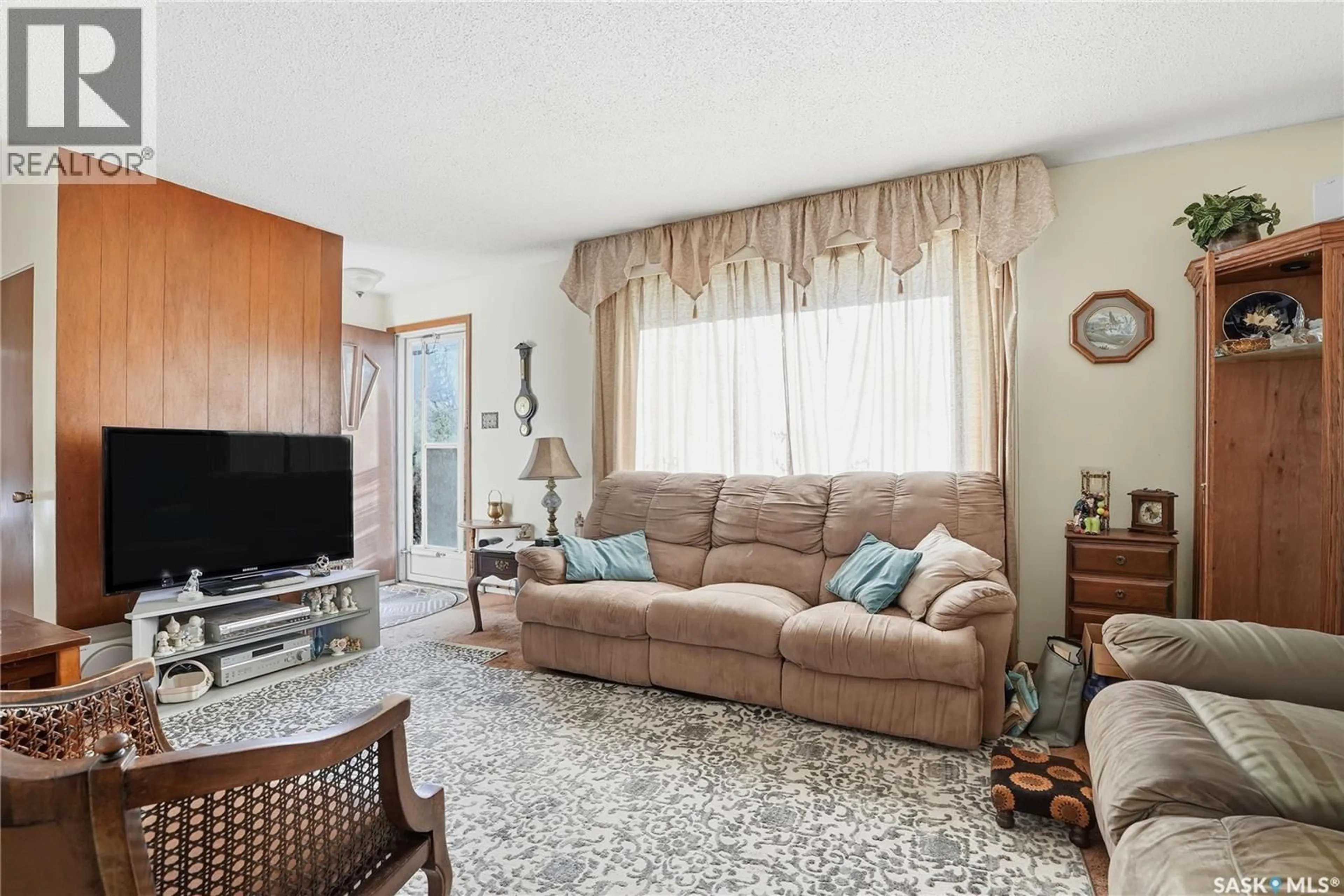 Living room with furniture, unknown for 23 JOHN EAST AVENUE, Saskatoon Saskatchewan S7L3S3