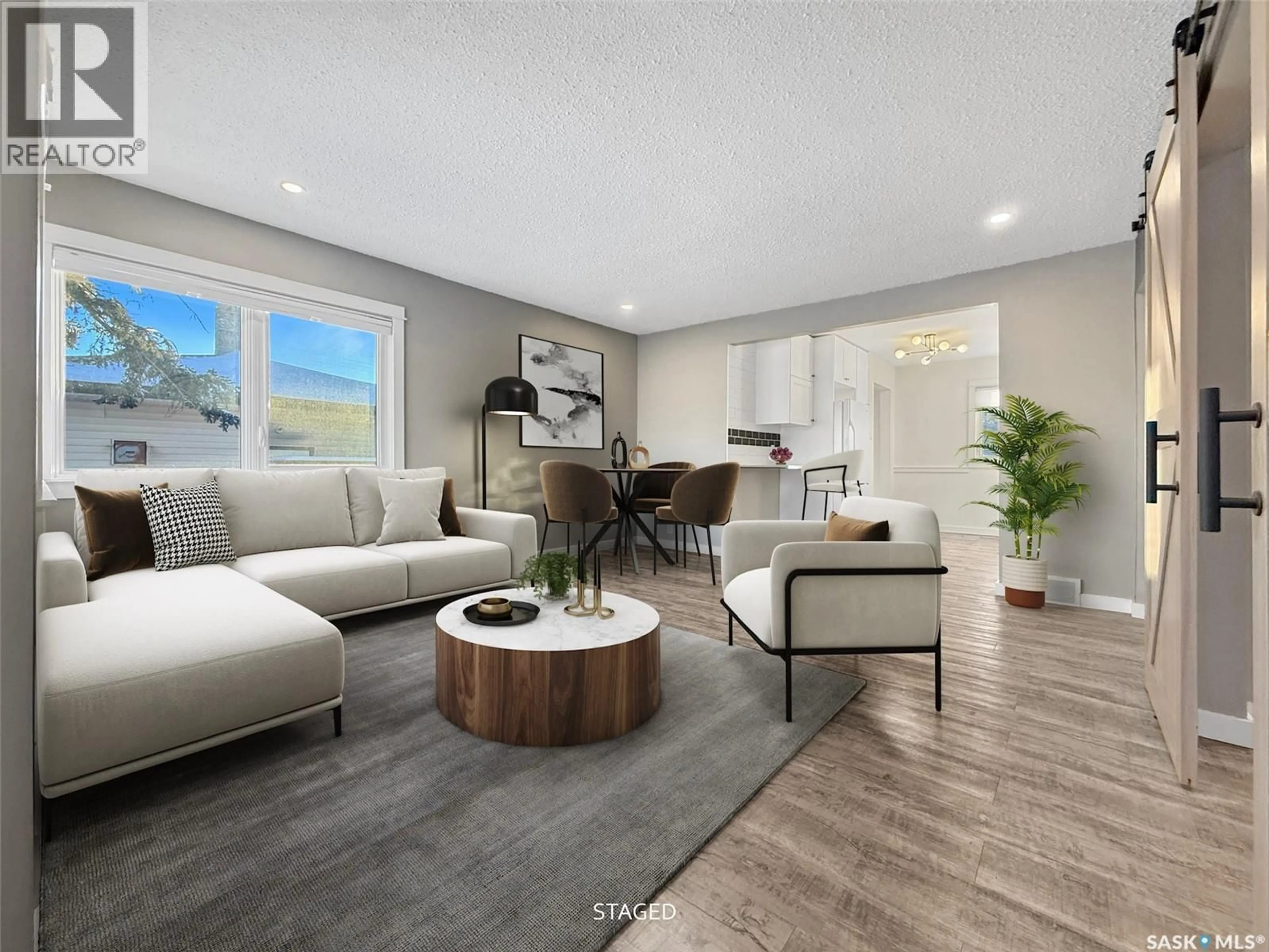 Living room with furniture, wood/laminate floor for 634 5TH AVENUE, Swift Current Saskatchewan S9H0X4