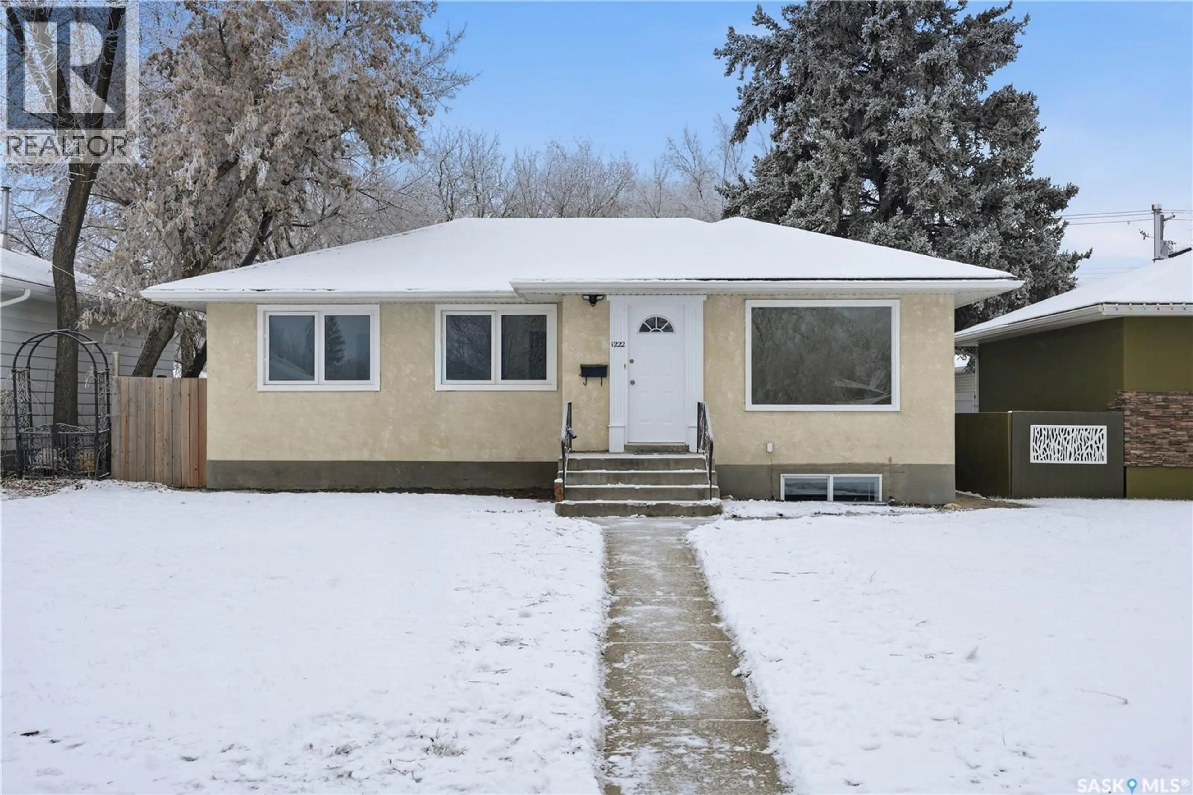 Home with vinyl exterior material, street for 1222 10TH STREET E, Saskatoon Saskatchewan S7H0H9
