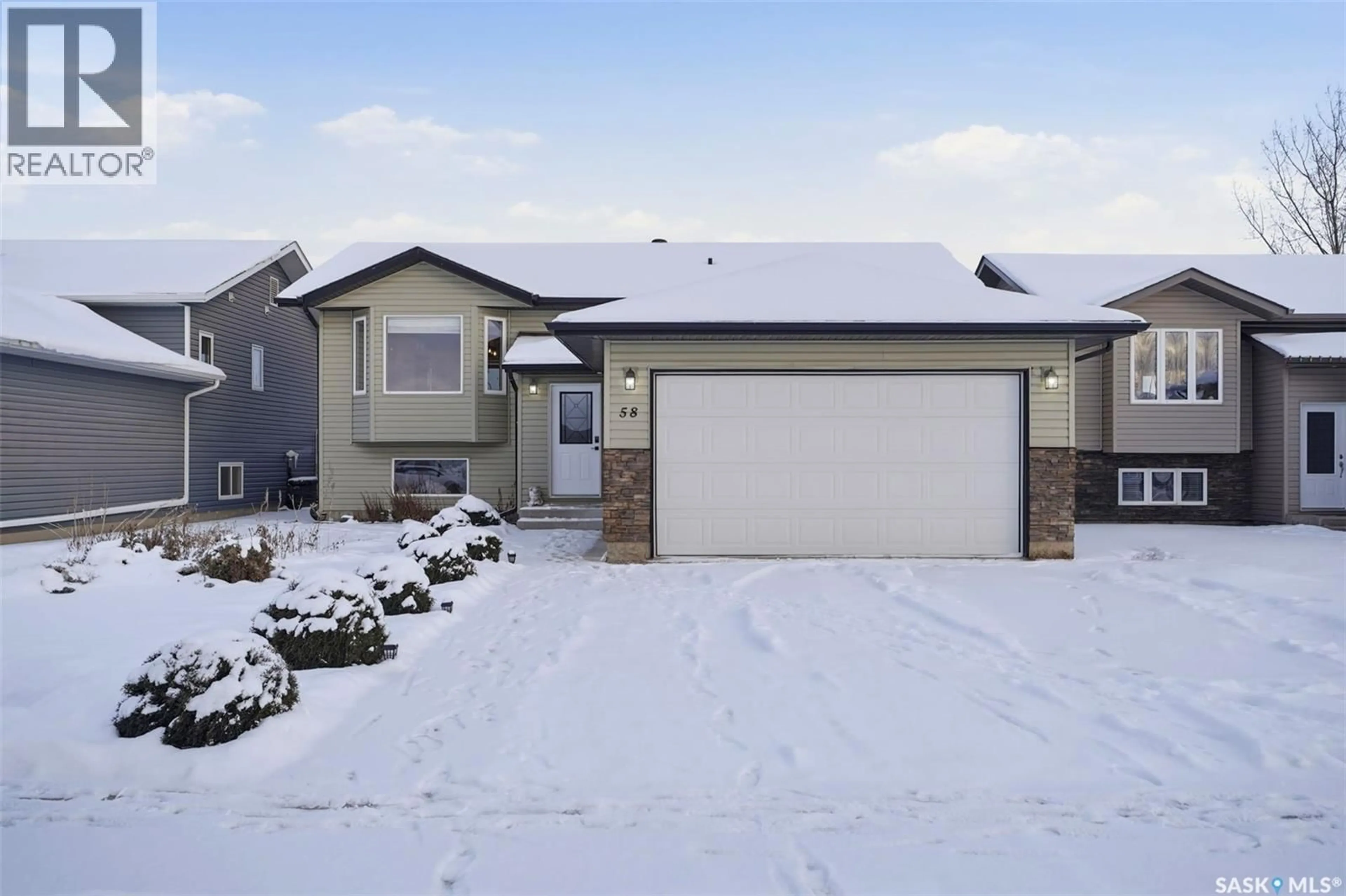 Home with vinyl exterior material, street for 58 RAIDER BAY, Prince Albert Saskatchewan S6V1H6