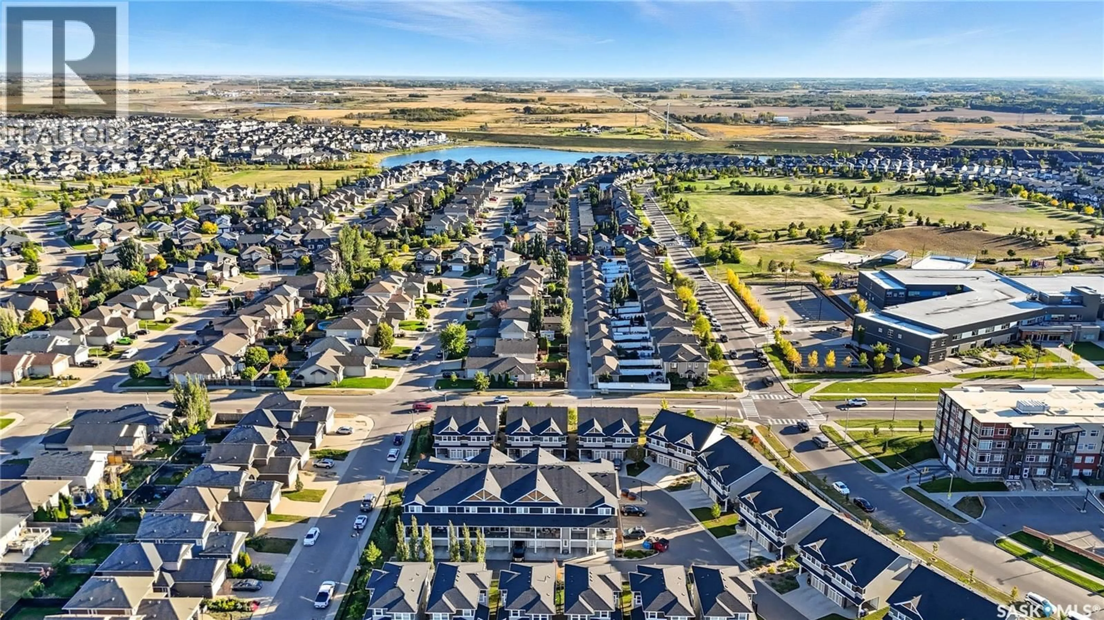 A pic from outside/outdoor area/front of a property/back of a property/a pic from drone, street for 210 315 DICKSON CRESCENT, Saskatoon Saskatchewan S7T0Z1