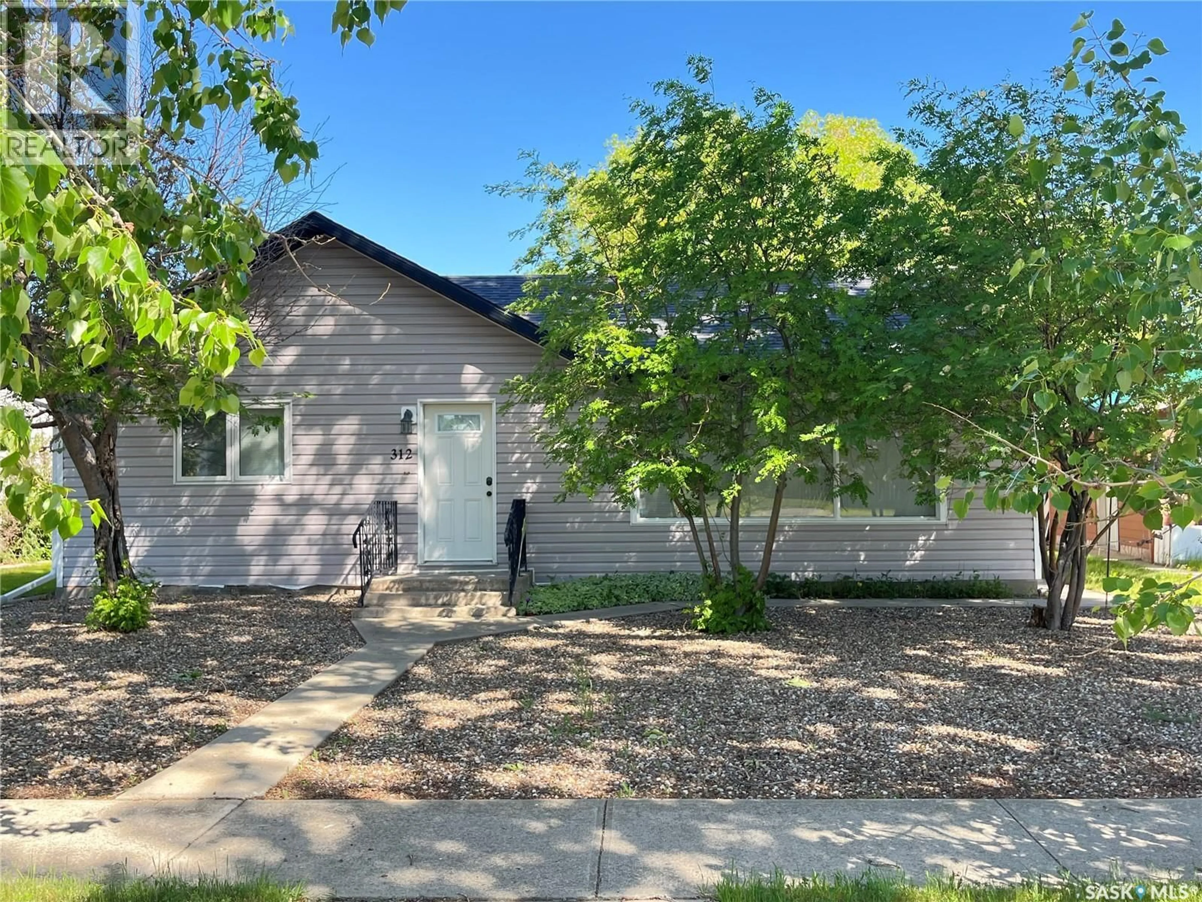 Home with vinyl exterior material, street for 312 CYPRESS STREET, Maple Creek Saskatchewan S0N1N0