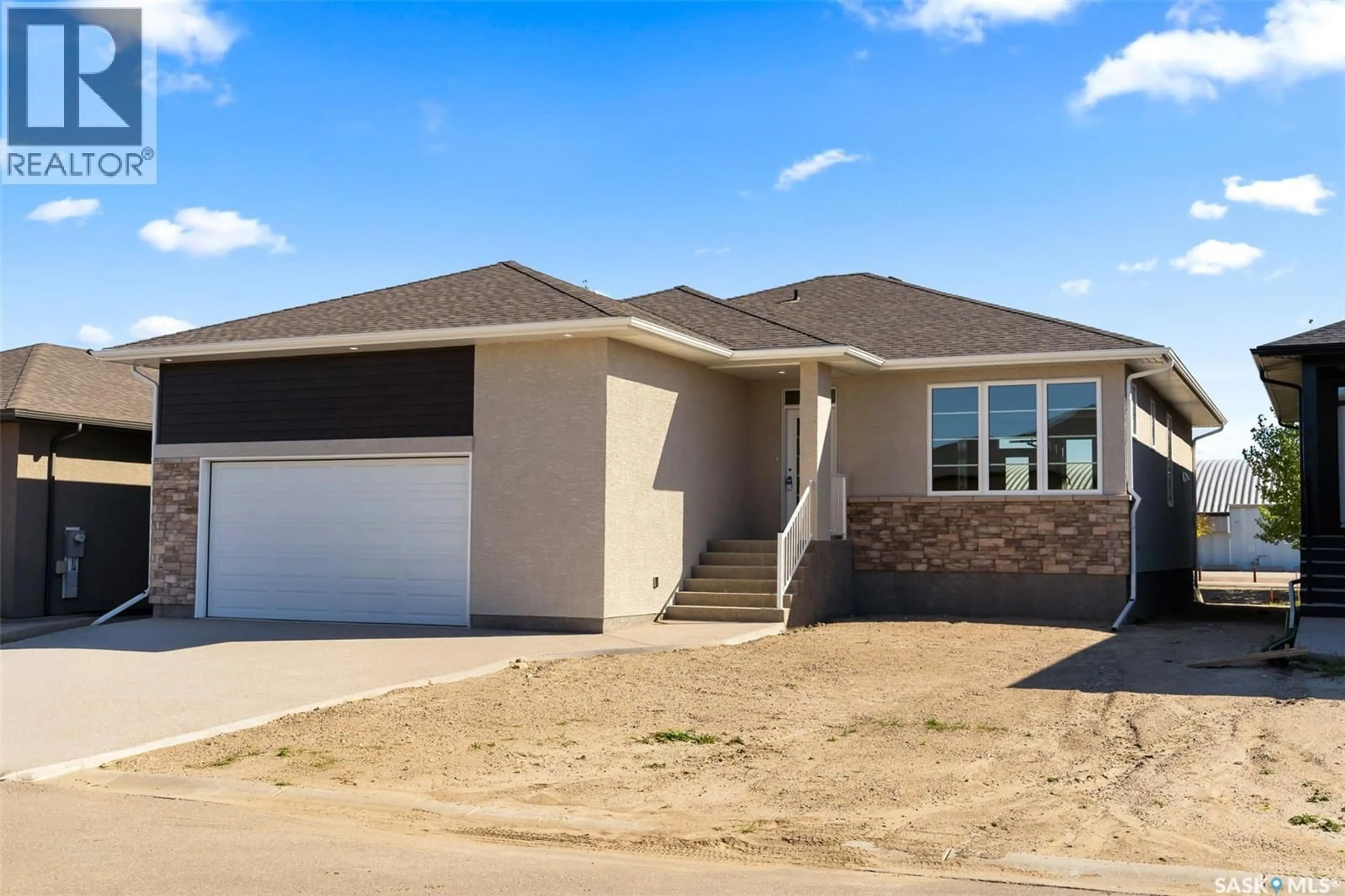 Home with vinyl exterior material, street for 5 KONANZ BAY, Balgonie Saskatchewan S0G0E0