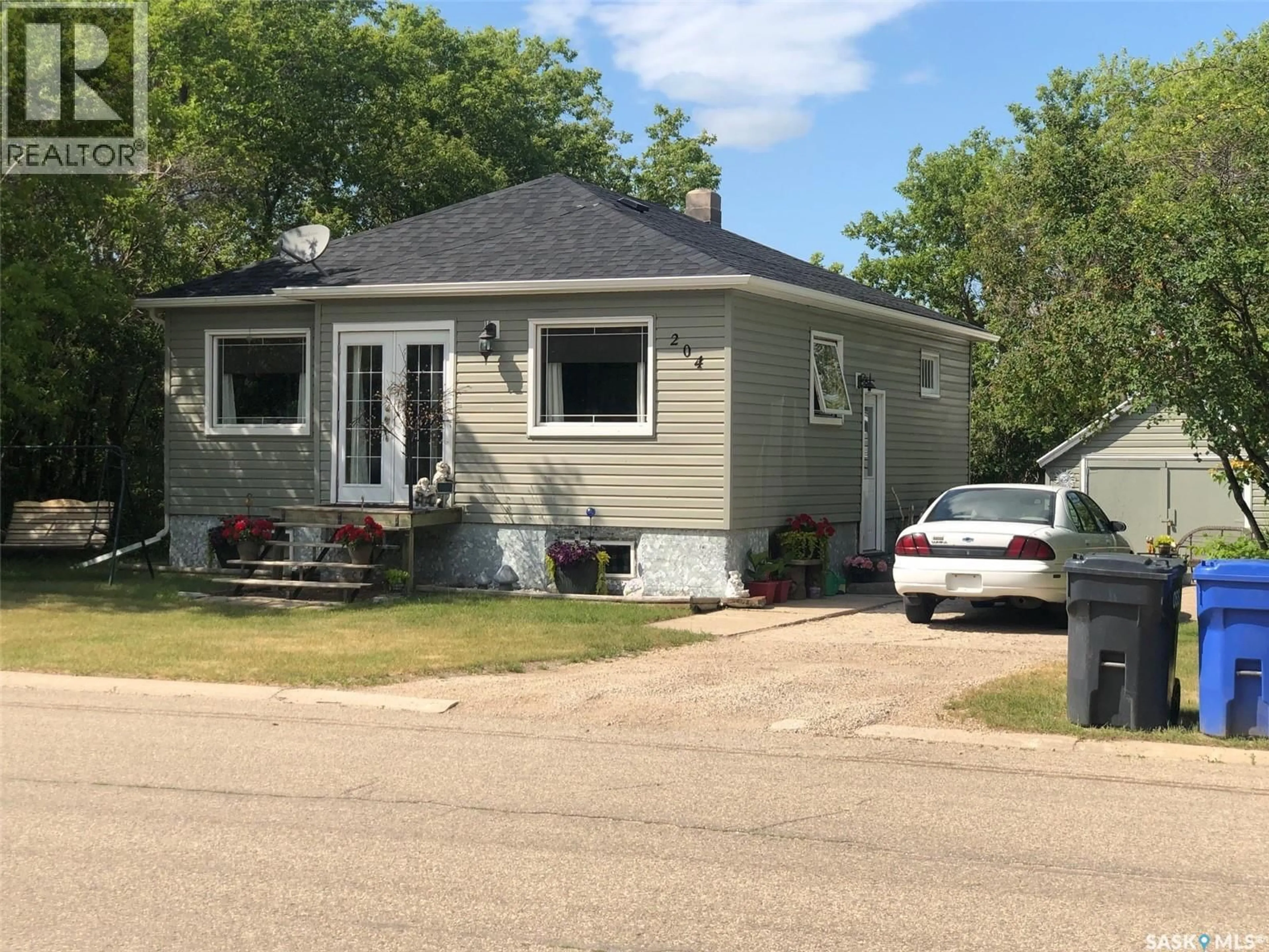 Home with vinyl exterior material, street for 204 CHARTER AVENUE, Canora Saskatchewan S0A0L0