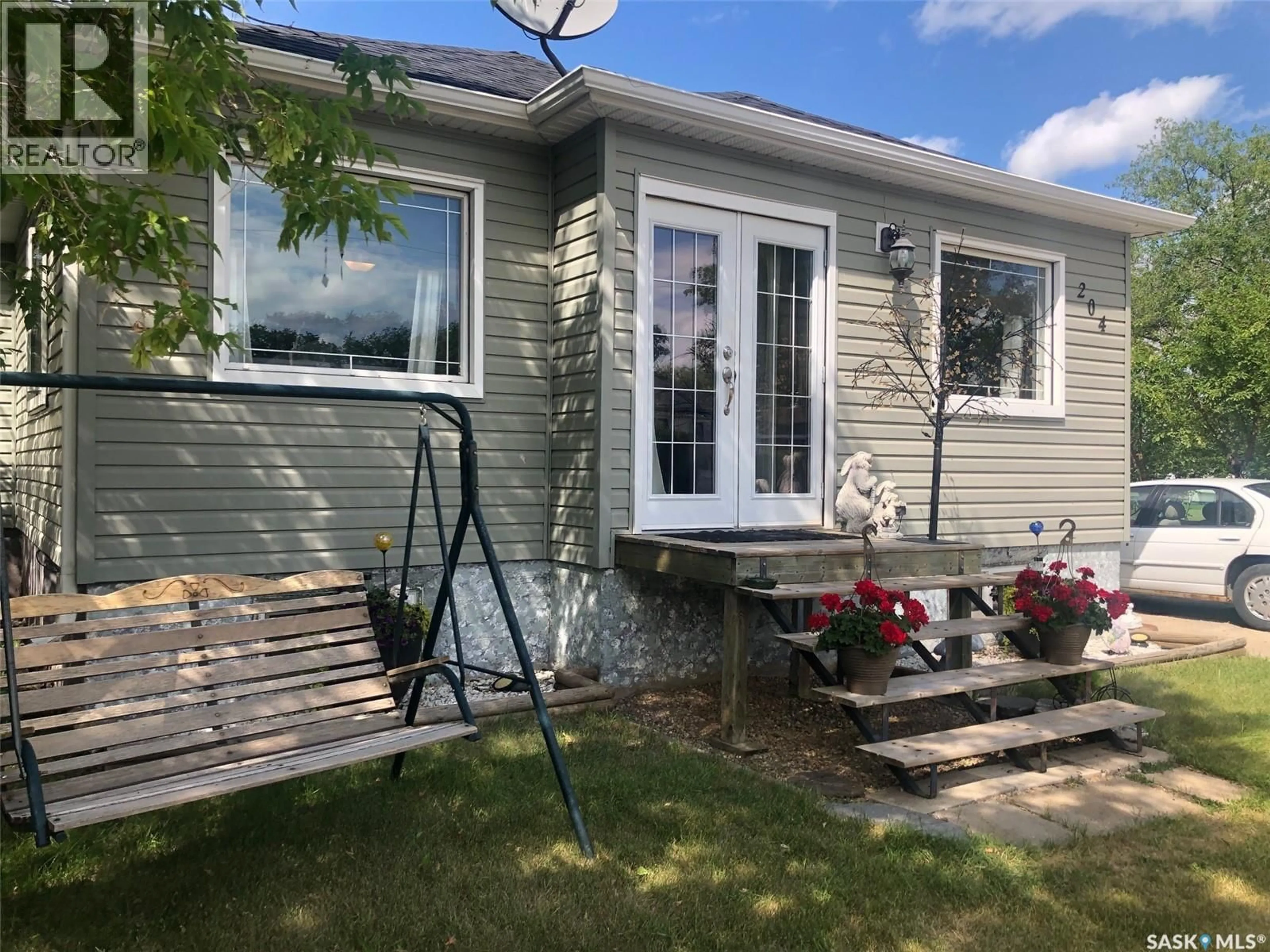 Home with vinyl exterior material, street for 204 CHARTER AVENUE, Canora Saskatchewan S0A0L0