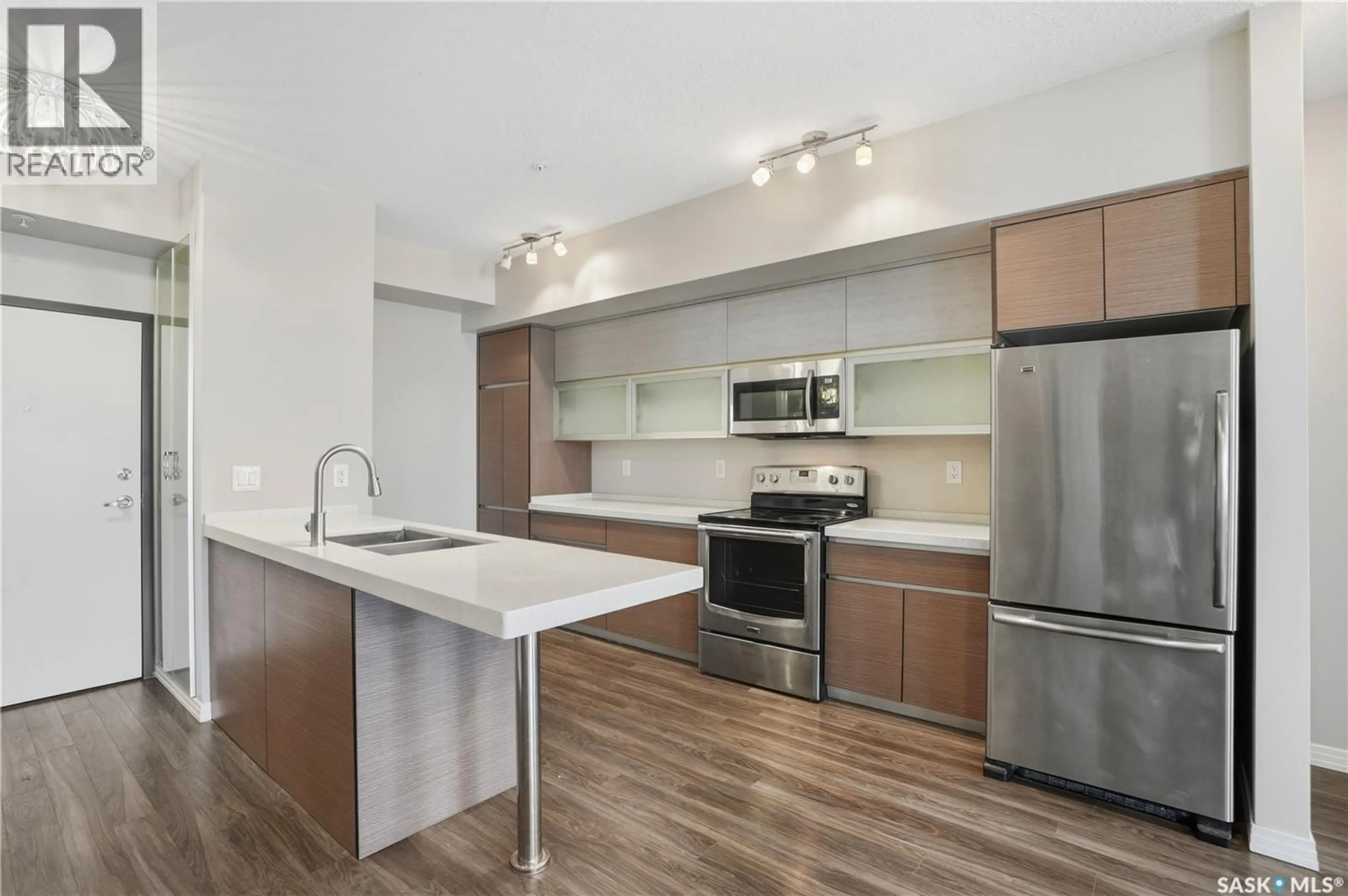 Open concept kitchen, wood/laminate floor for 221 235 EVERGREEN SQUARE, Saskatoon Saskatchewan S7W0P9