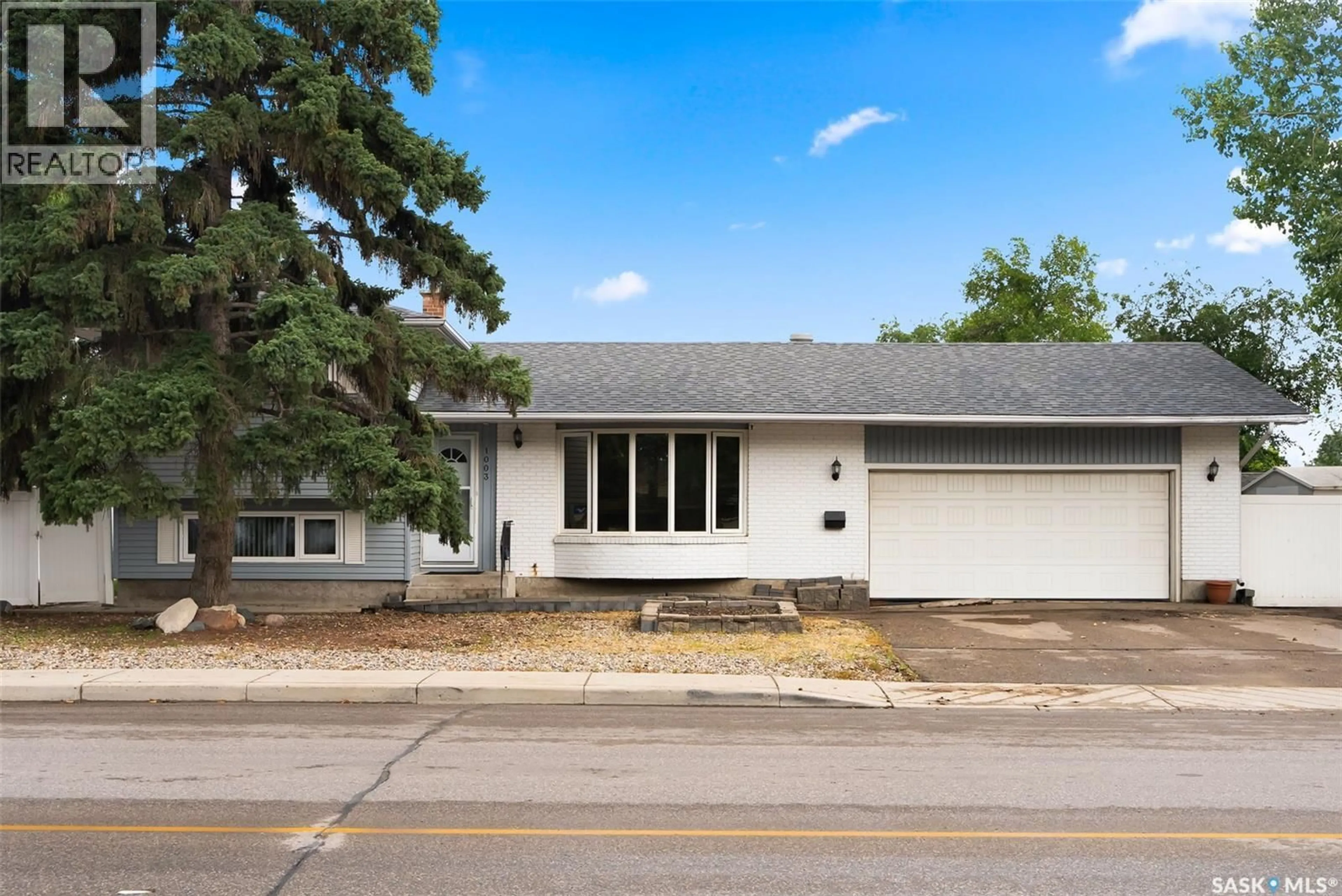 Home with vinyl exterior material, street for 1003 BROAD STREET, Regina Saskatchewan S4R6V2