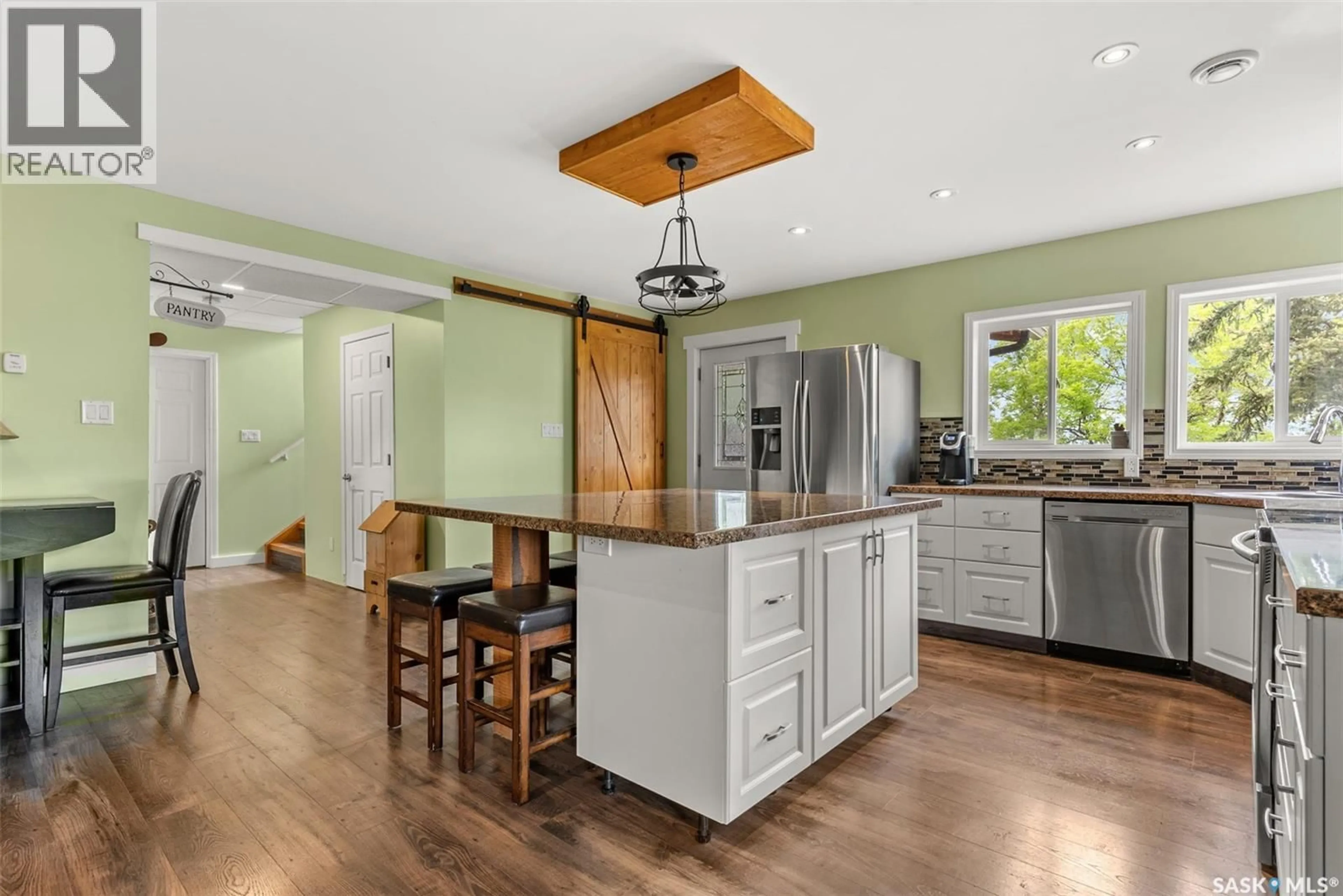 Open concept kitchen, wood/laminate floor for 225 3RD STREET, Regina Beach Saskatchewan S0G4C0