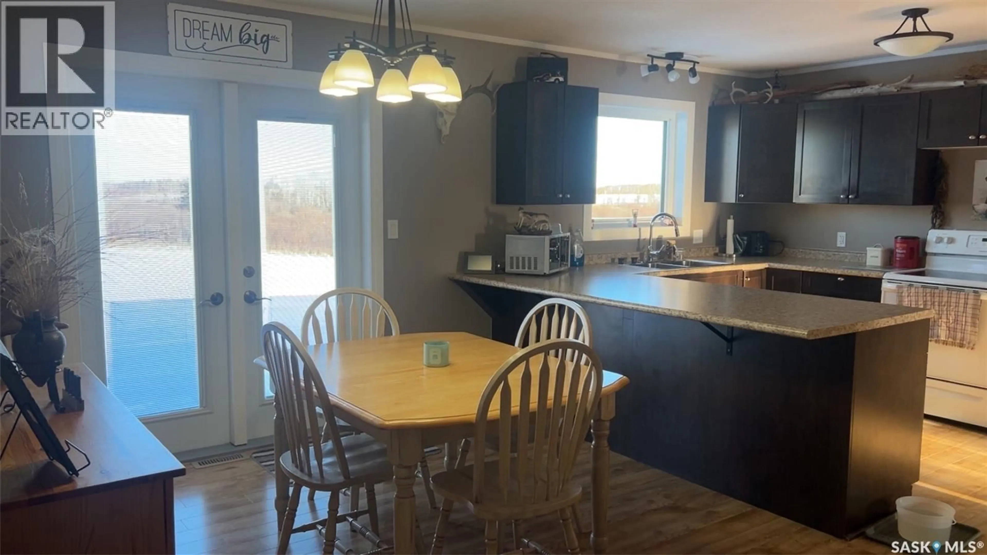 Open concept kitchen, wood/laminate floor for GARDNER DREAM ACREAGE, Preeceville Rm No. 334 Saskatchewan S0A3B0