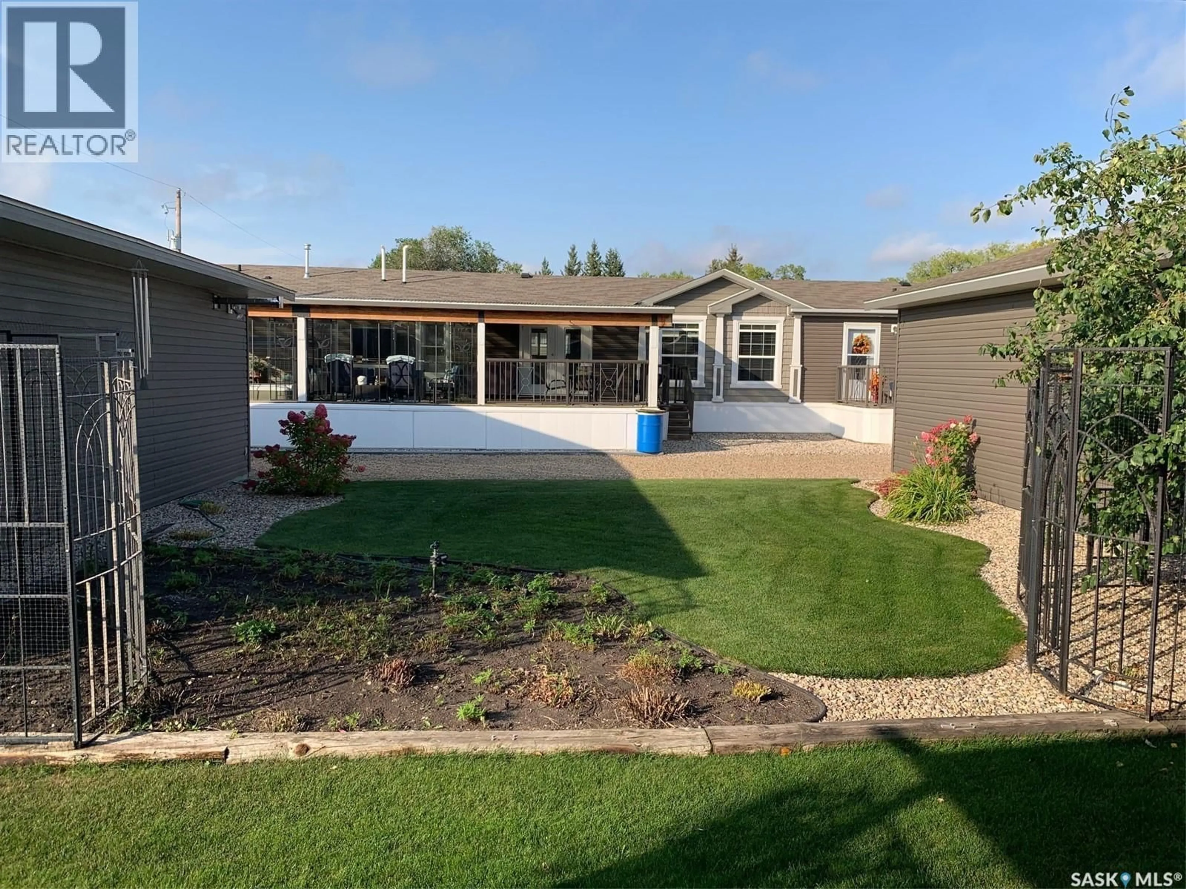 A pic from outside/outdoor area/front of a property/back of a property/a pic from drone, street for 115 PATRICIA STREET, Hudson Bay Saskatchewan S0E0Y0
