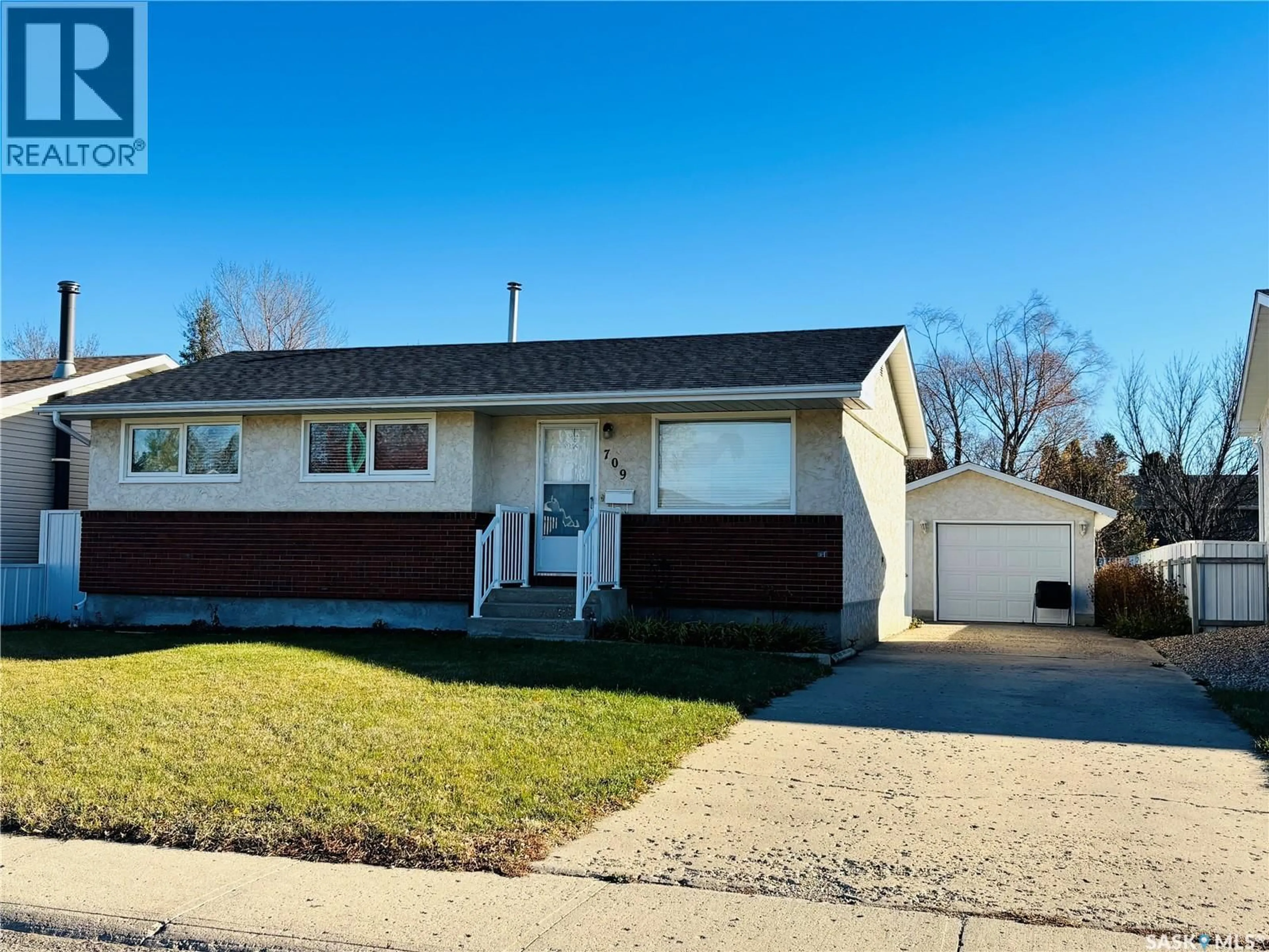 Home with vinyl exterior material, street for 709 ARTHUR AVENUE, Estevan Saskatchewan S4A1K5