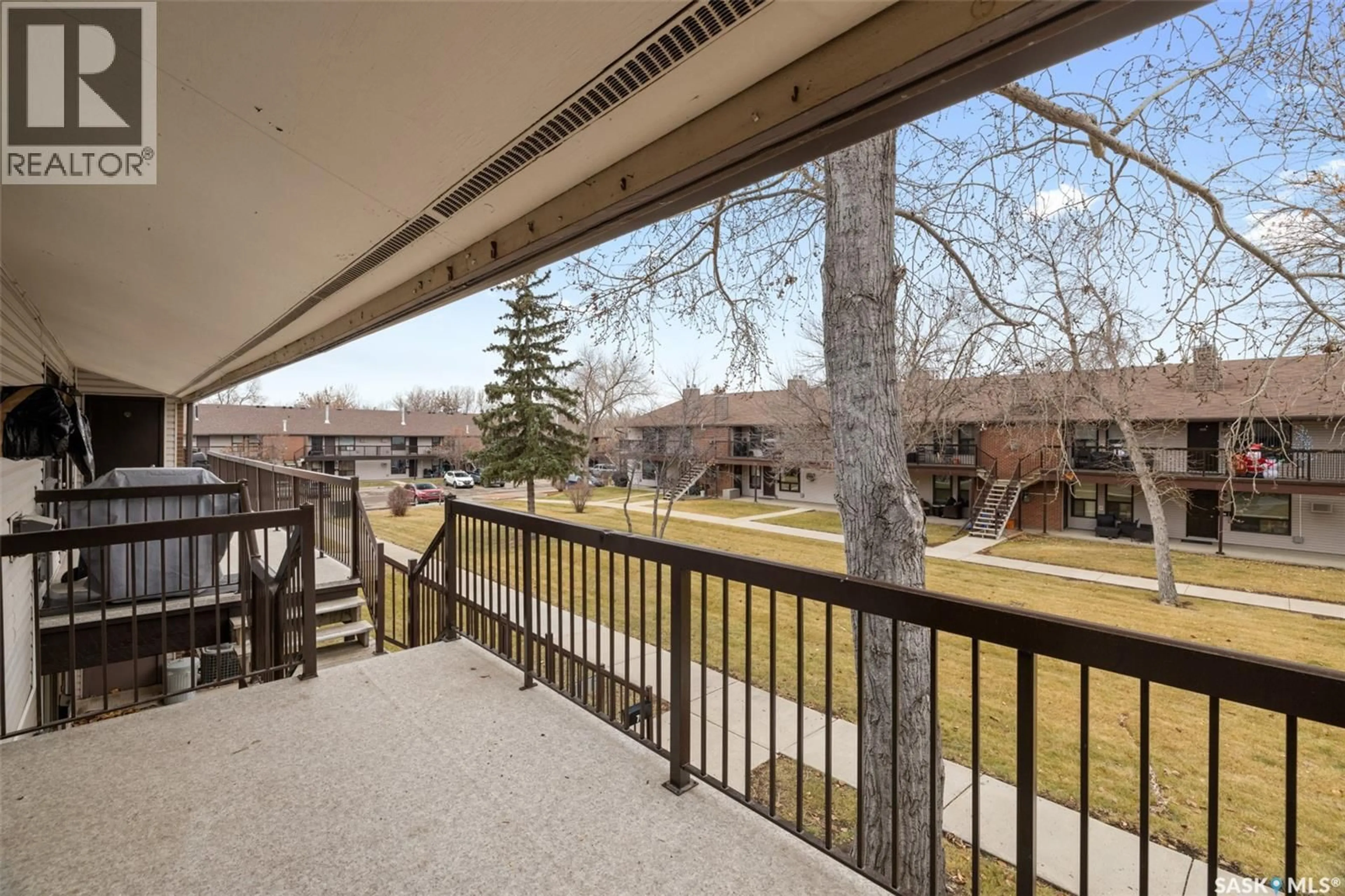 Patio, city buildings view from balcony for 70 GORE PLACE, Regina Saskatchewan S4T7S4