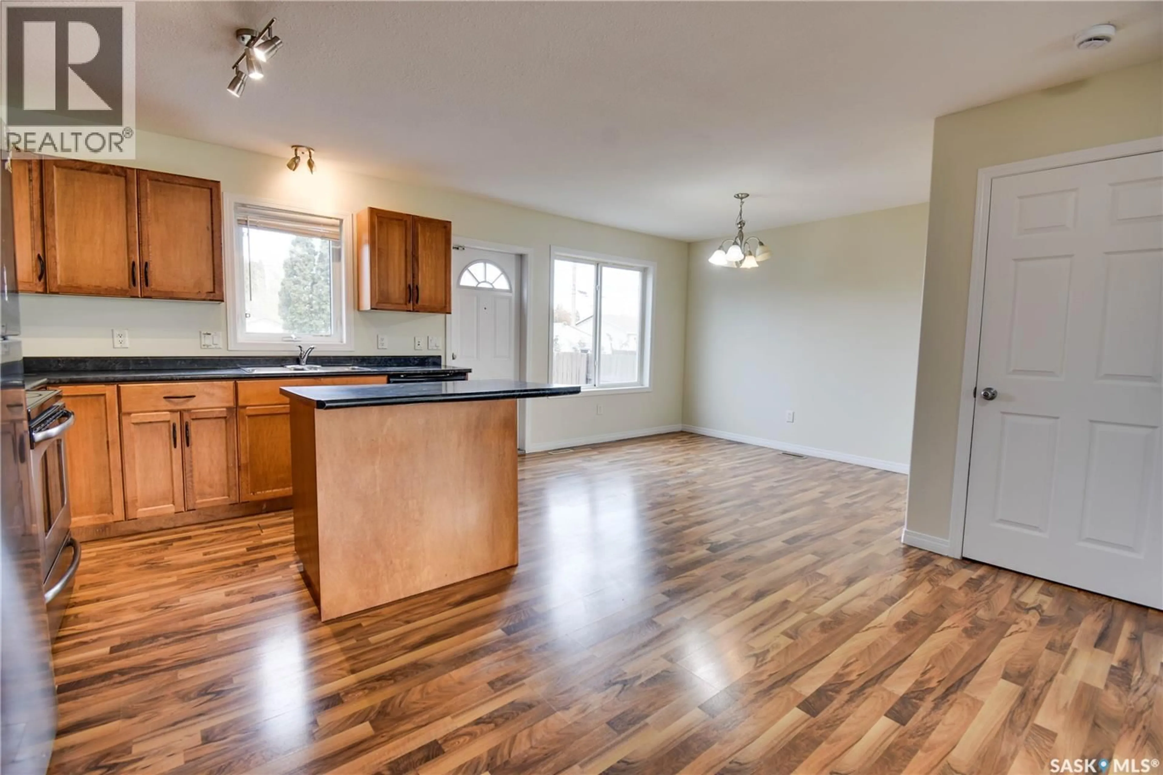 Open concept kitchen, wood/laminate floor for 120 115TH STREET, Saskatoon Saskatchewan S7N1W3