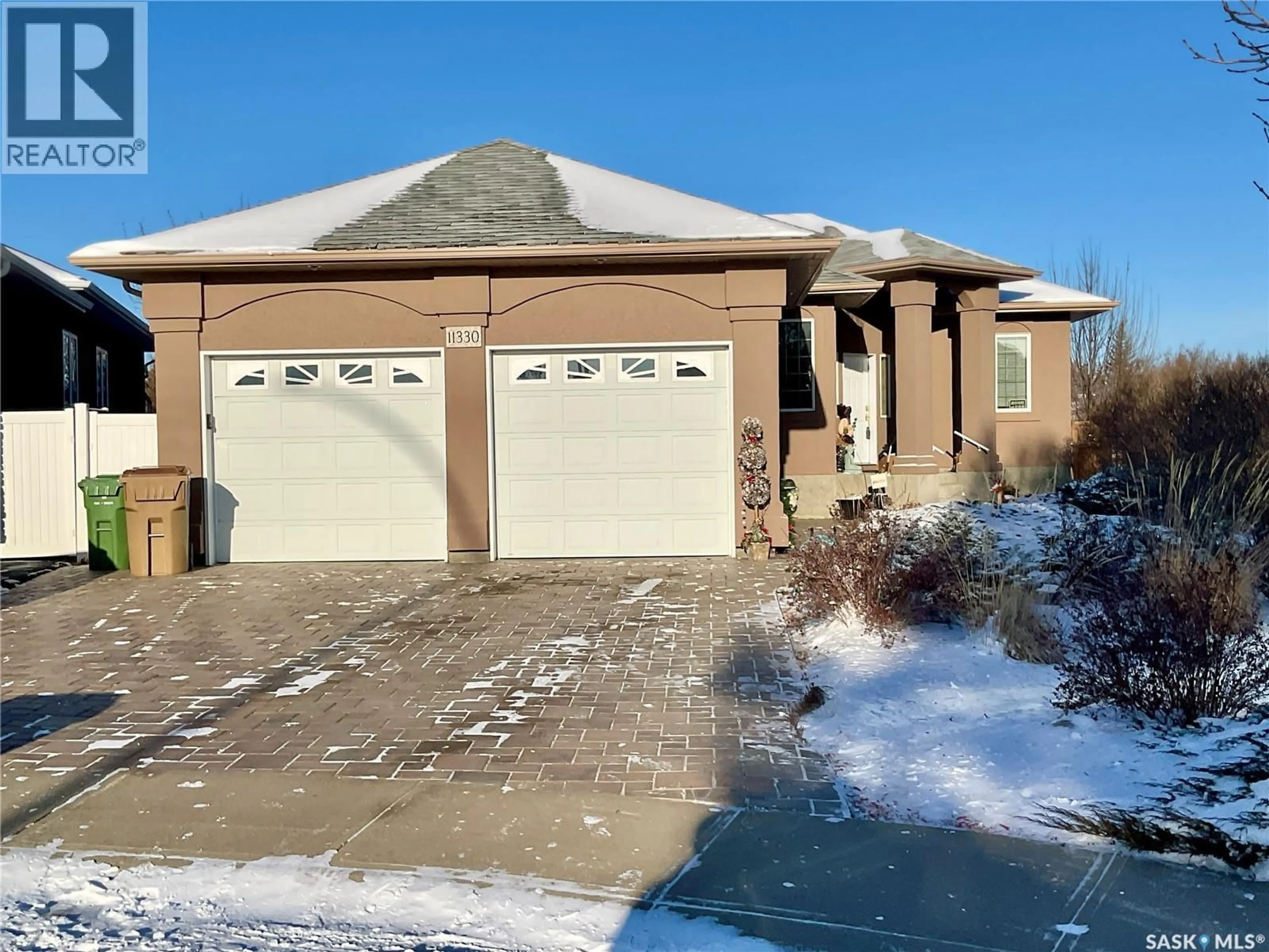 Home with brick exterior material, street for 11330 WASCANA MEADOWS, Regina Saskatchewan S4V2V4