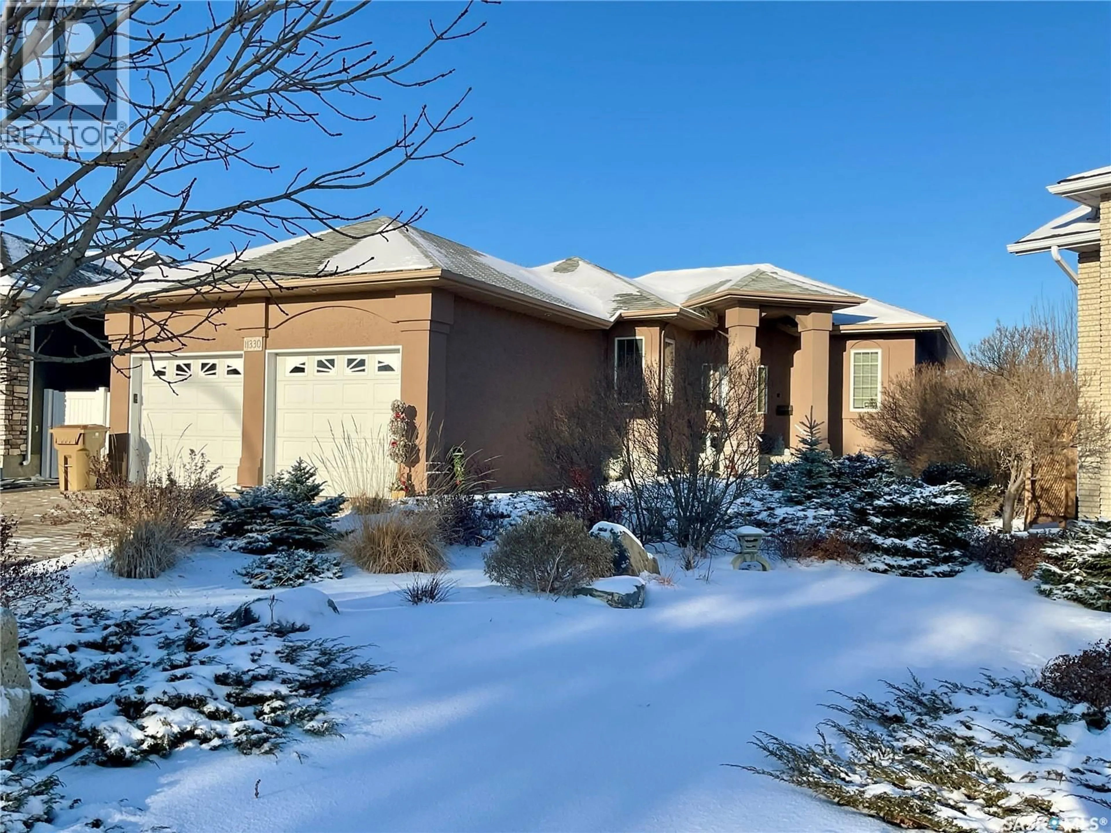 Home with brick exterior material, street for 11330 WASCANA MEADOWS, Regina Saskatchewan S4V2V4