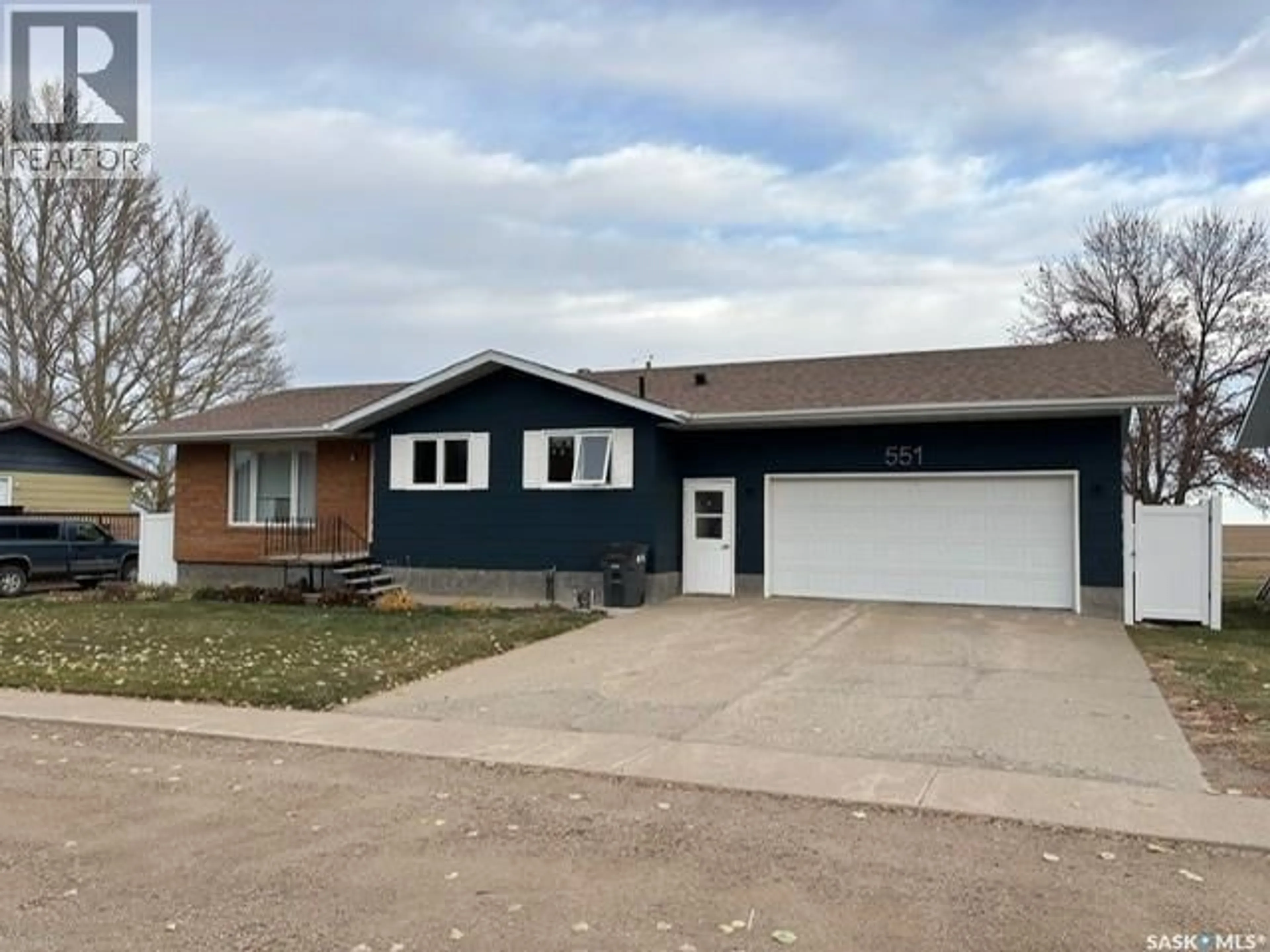 Home with vinyl exterior material, street for 551 1ST STREET, Lafleche Saskatchewan S0H2K0