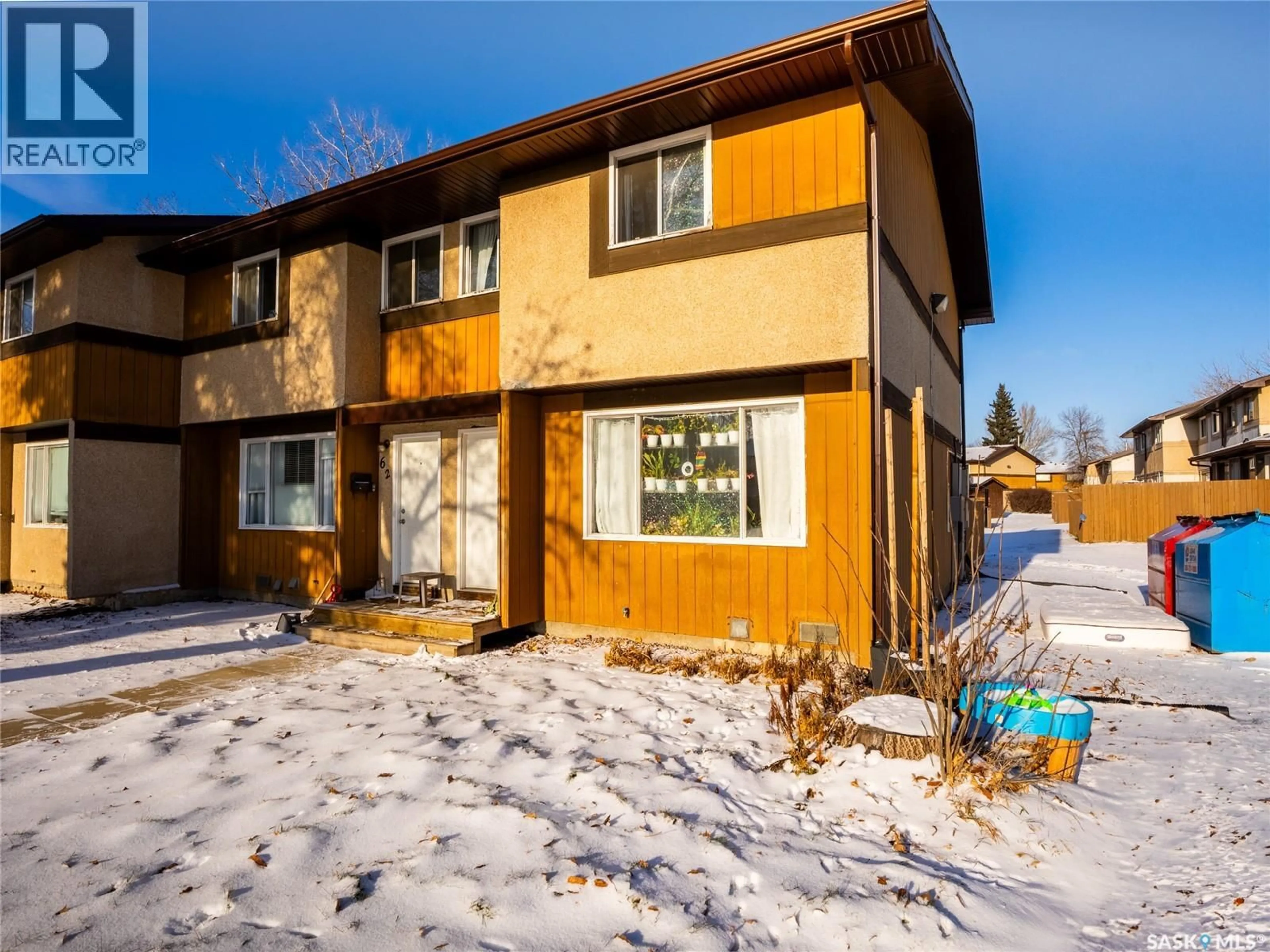 Home with vinyl exterior material, street for 58 MACKENZIE MEWS, Regina Saskatchewan S4N5M5
