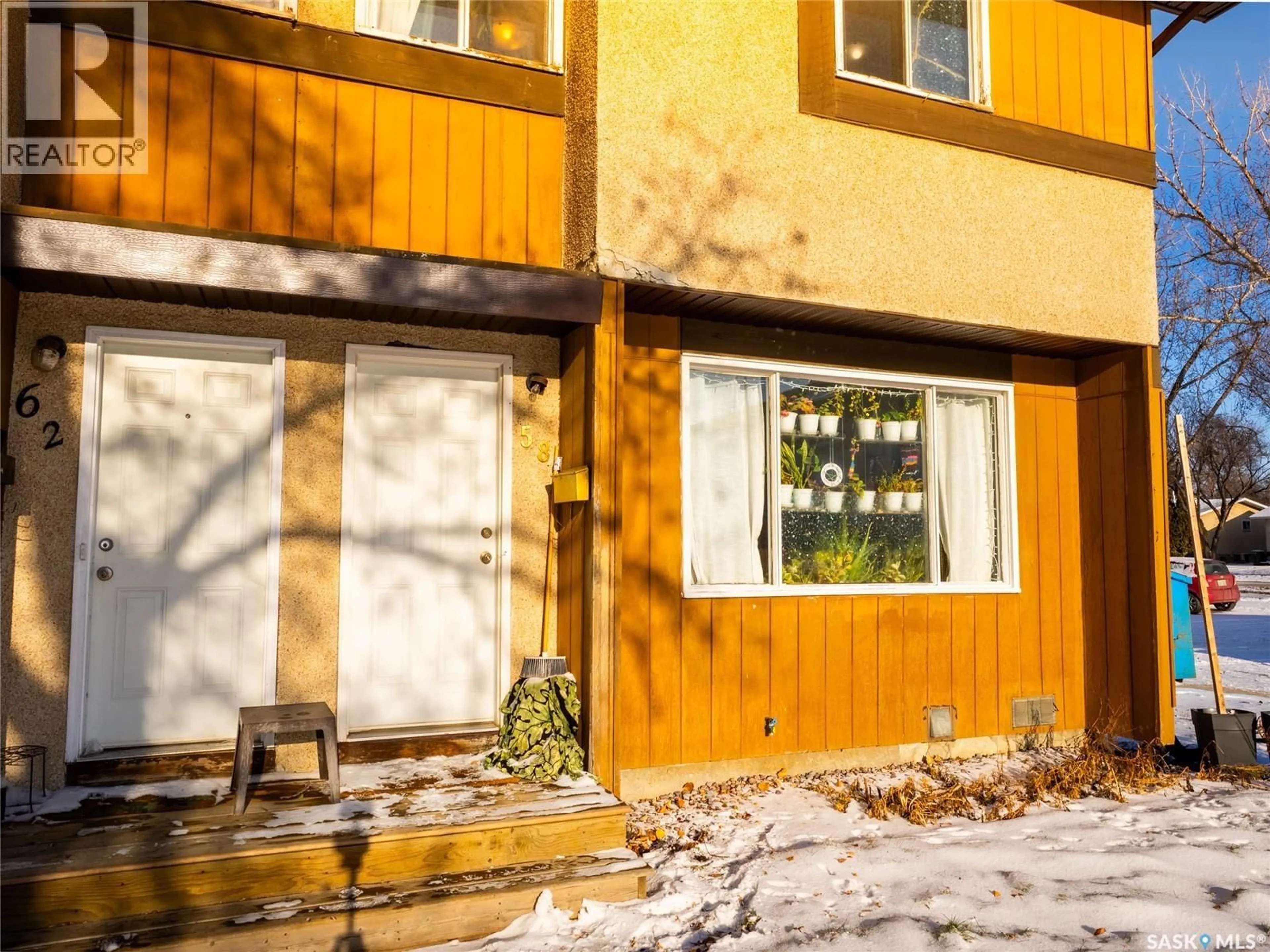 Home with vinyl exterior material, street for 58 MACKENZIE MEWS, Regina Saskatchewan S4N5M5