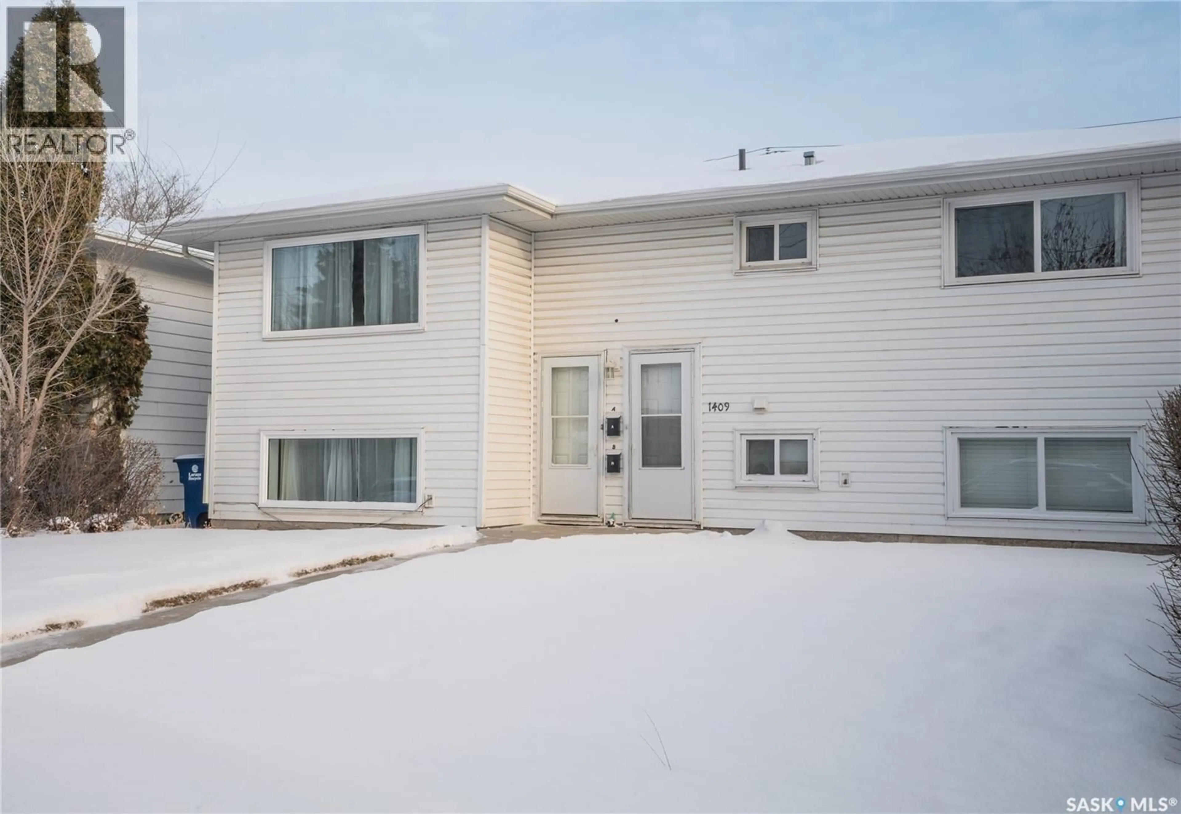 Home with vinyl exterior material, street for S - 1409 PRESTON AVENUE, Saskatoon Saskatchewan S7H2V5