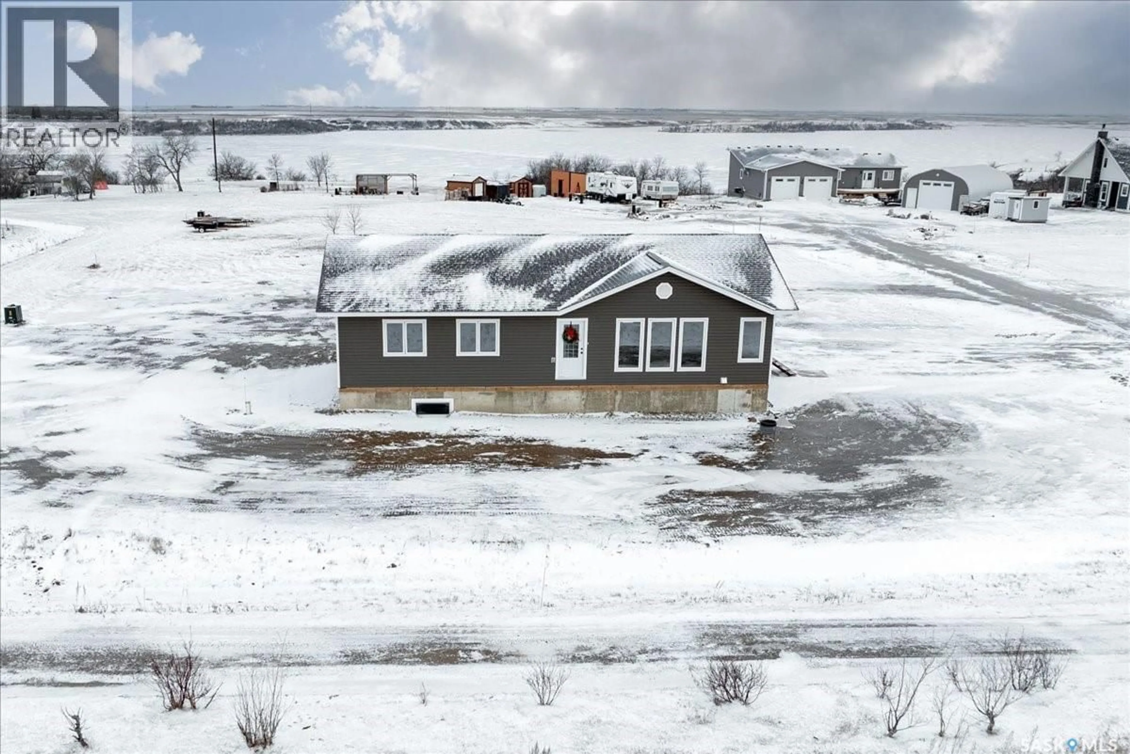 A pic from outside/outdoor area/front of a property/back of a property/a pic from drone, building for 11 JESSE BAY, Mckillop Rm No. 220 Saskatchewan S0G4V0