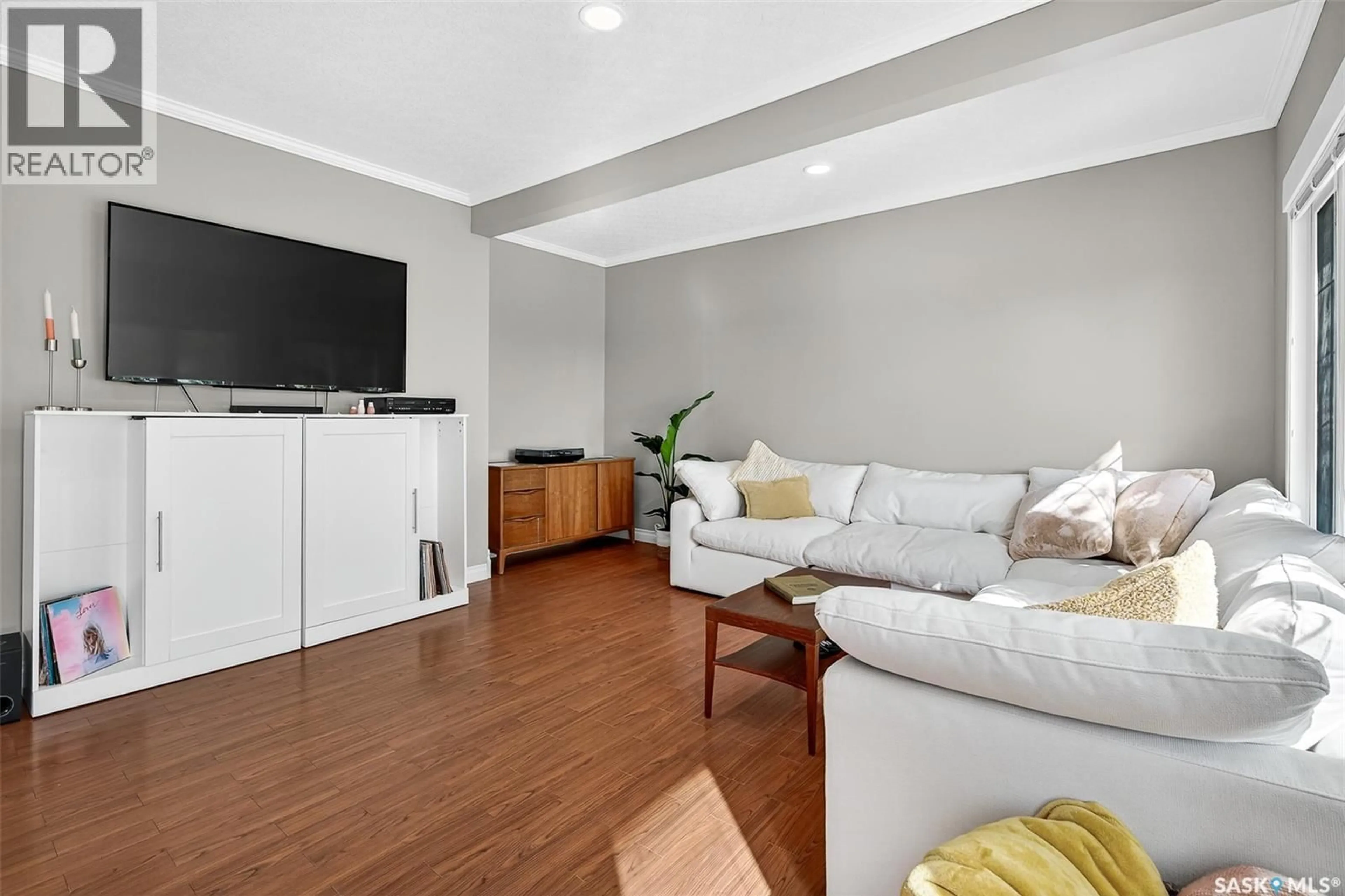 Living room with furniture, wood/laminate floor for 1116 HOCHELAGA STREET, Moose Jaw Saskatchewan S6H2J2