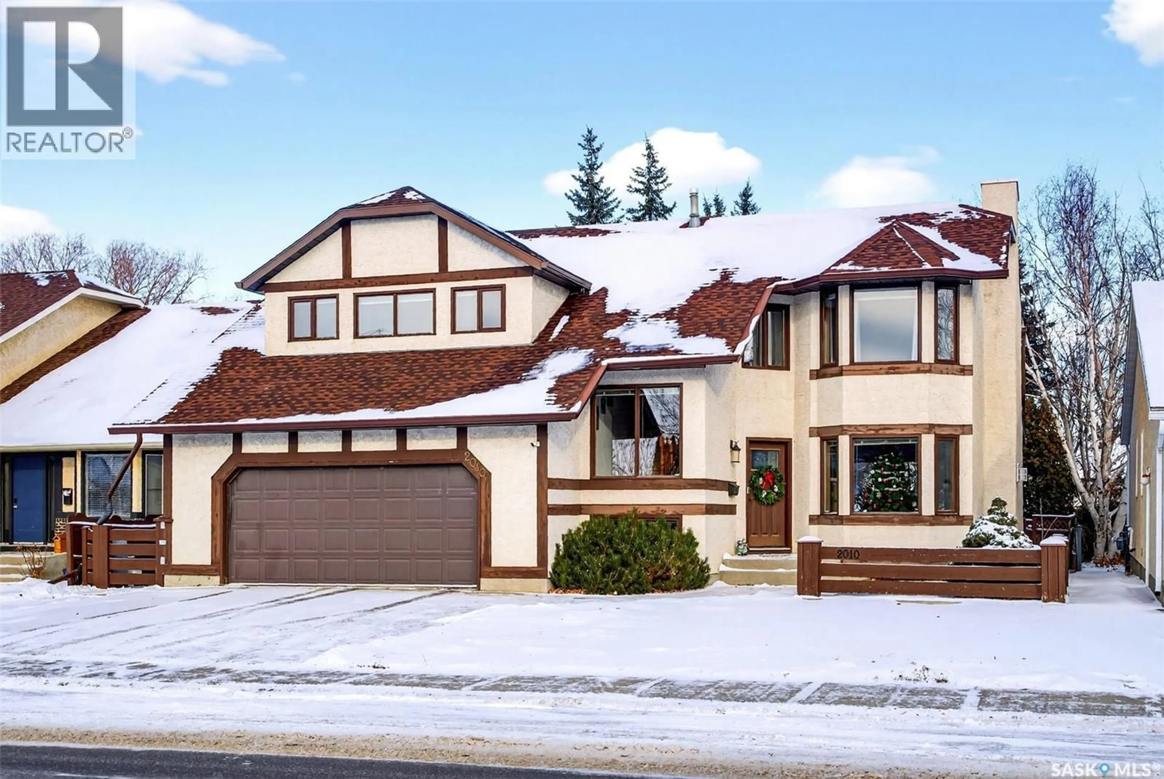 Home with vinyl exterior material, street for 2010 ASSINIBOINE AVENUE, Regina Saskatchewan S4V2E2