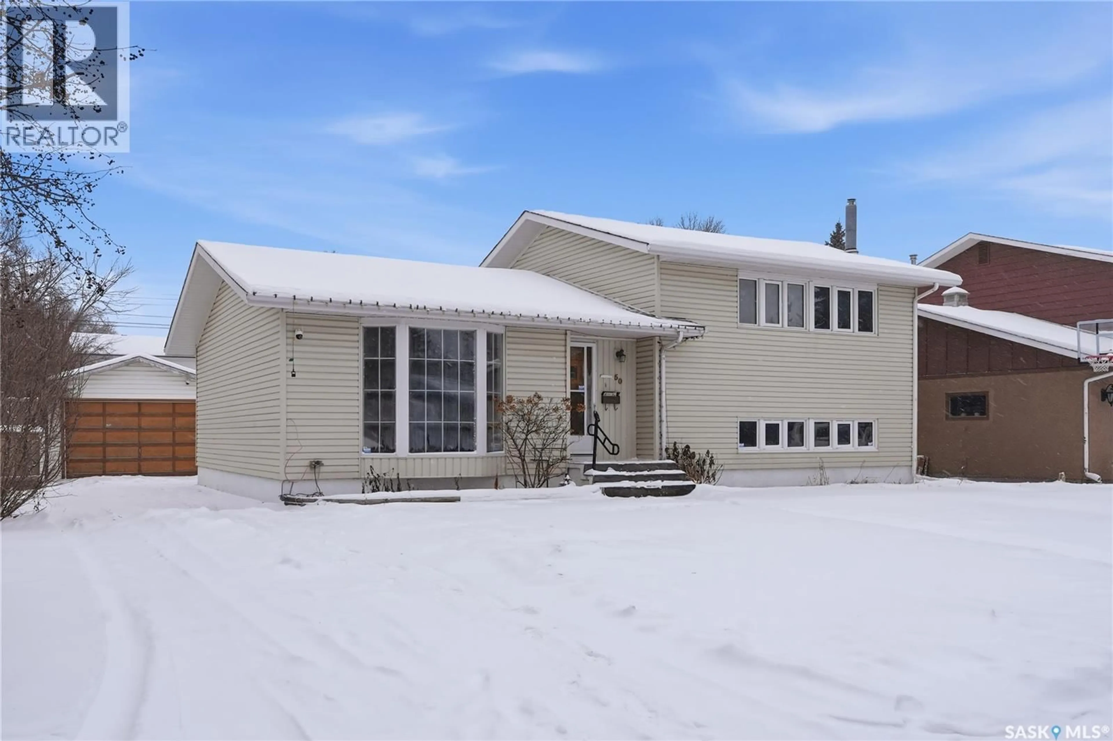 Home with vinyl exterior material, street for 50 RAWSON CRESCENT, Saskatoon Saskatchewan S7H3X3