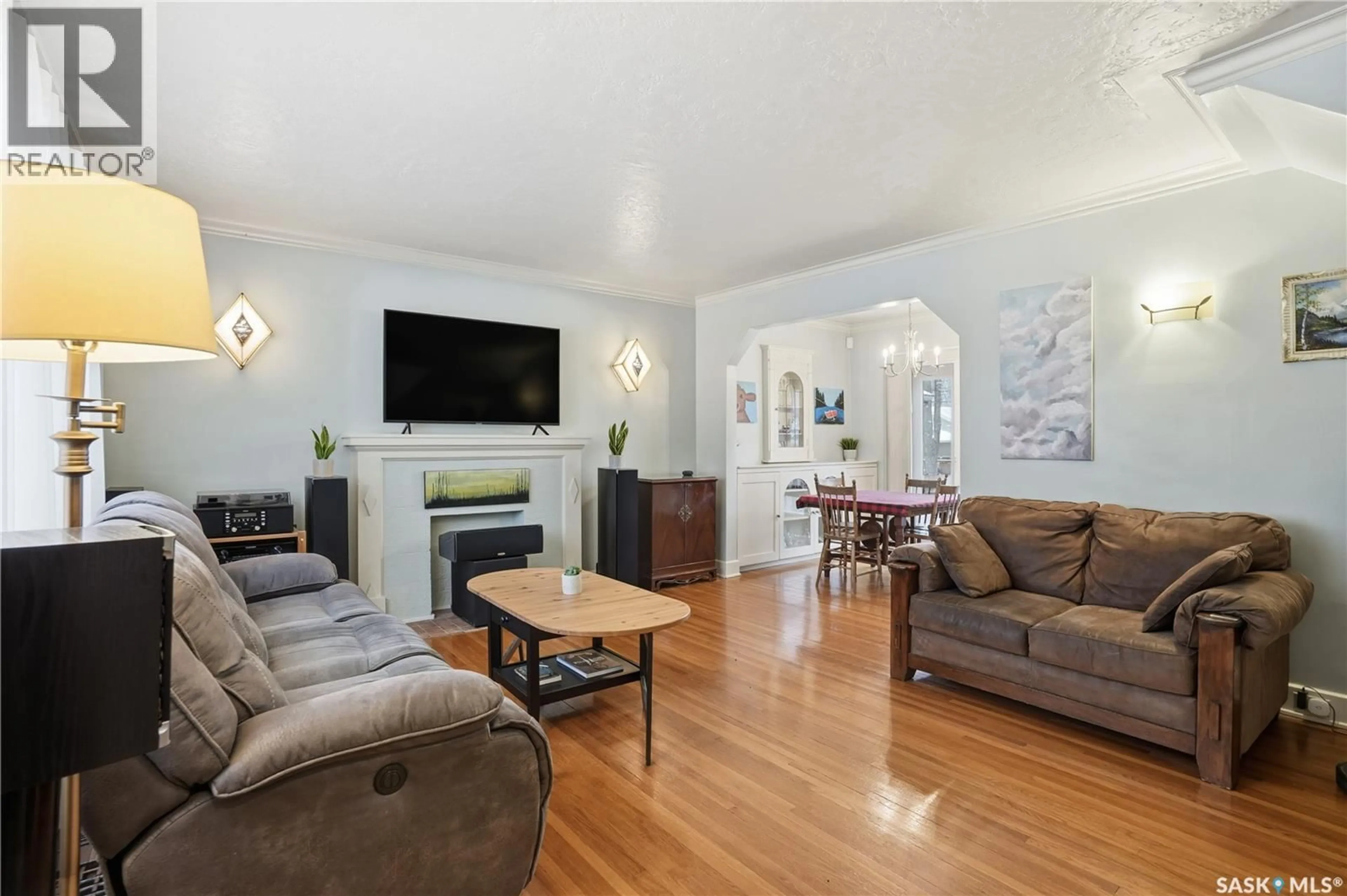 Living room with furniture, wood/laminate floor for 2221 ATHOL STREET, Regina Saskatchewan S4T3G2