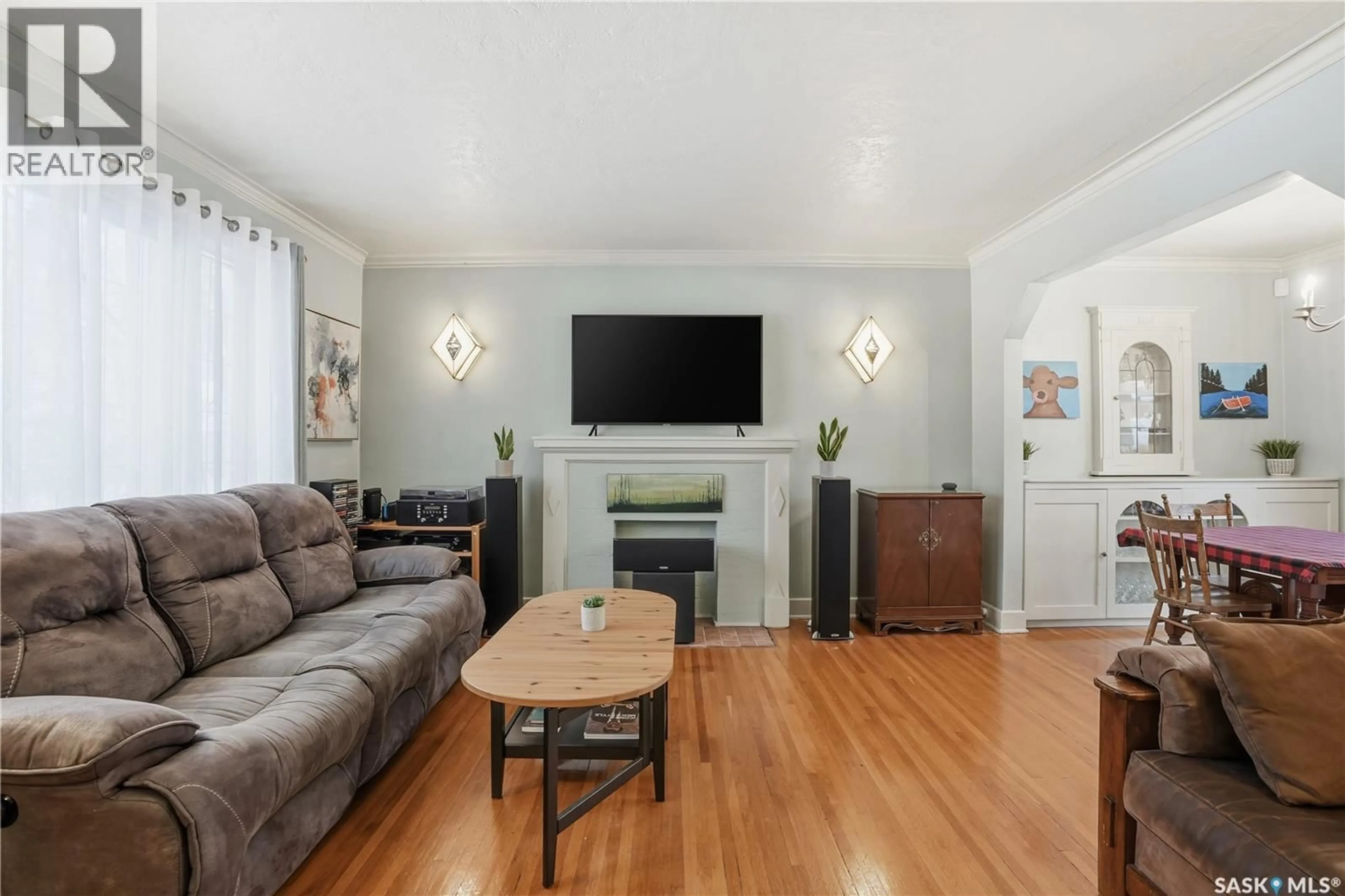 Living room with furniture, wood/laminate floor for 2221 ATHOL STREET, Regina Saskatchewan S4T3G2