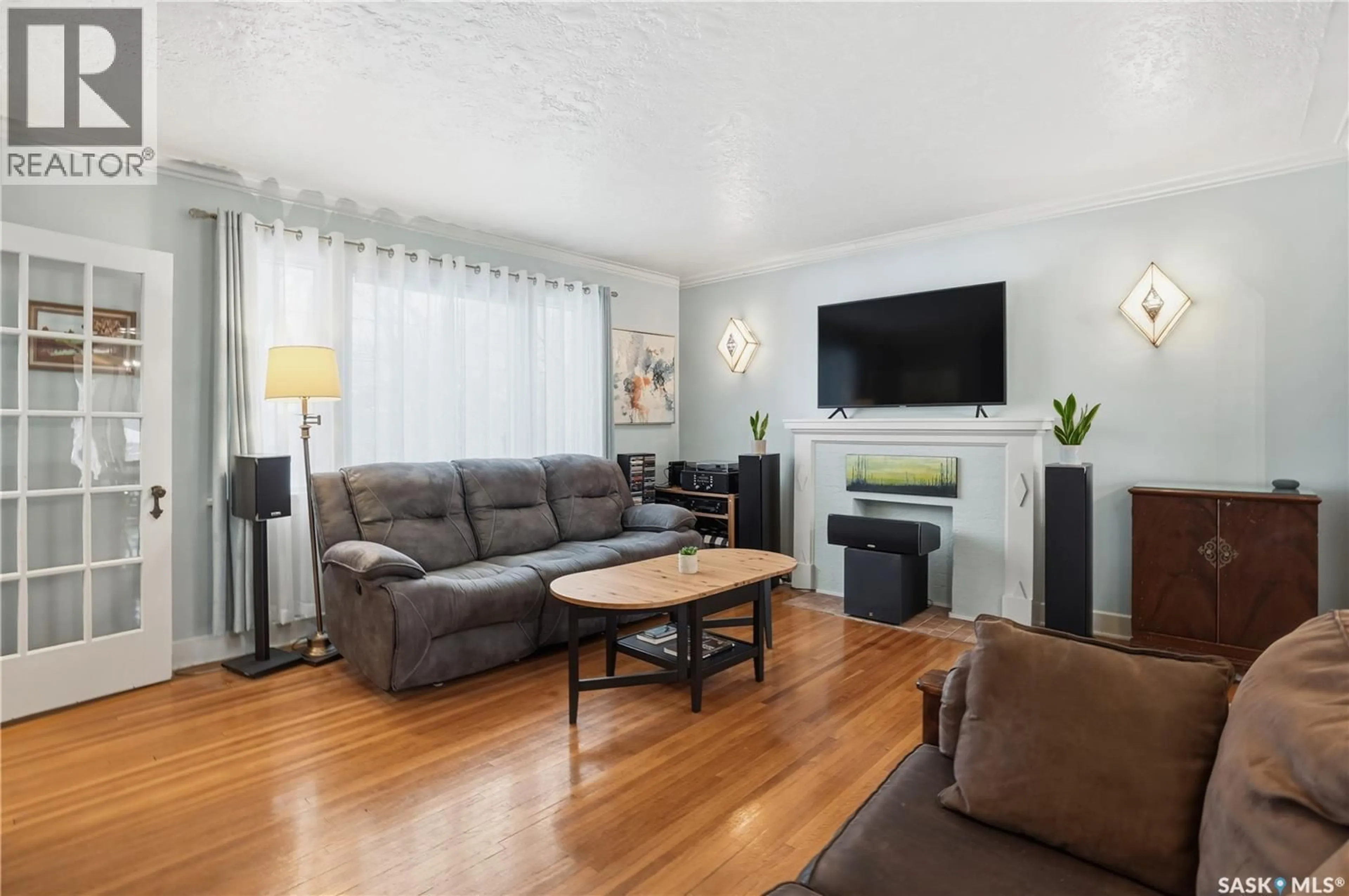 Living room with furniture, wood/laminate floor for 2221 ATHOL STREET, Regina Saskatchewan S4T3G2