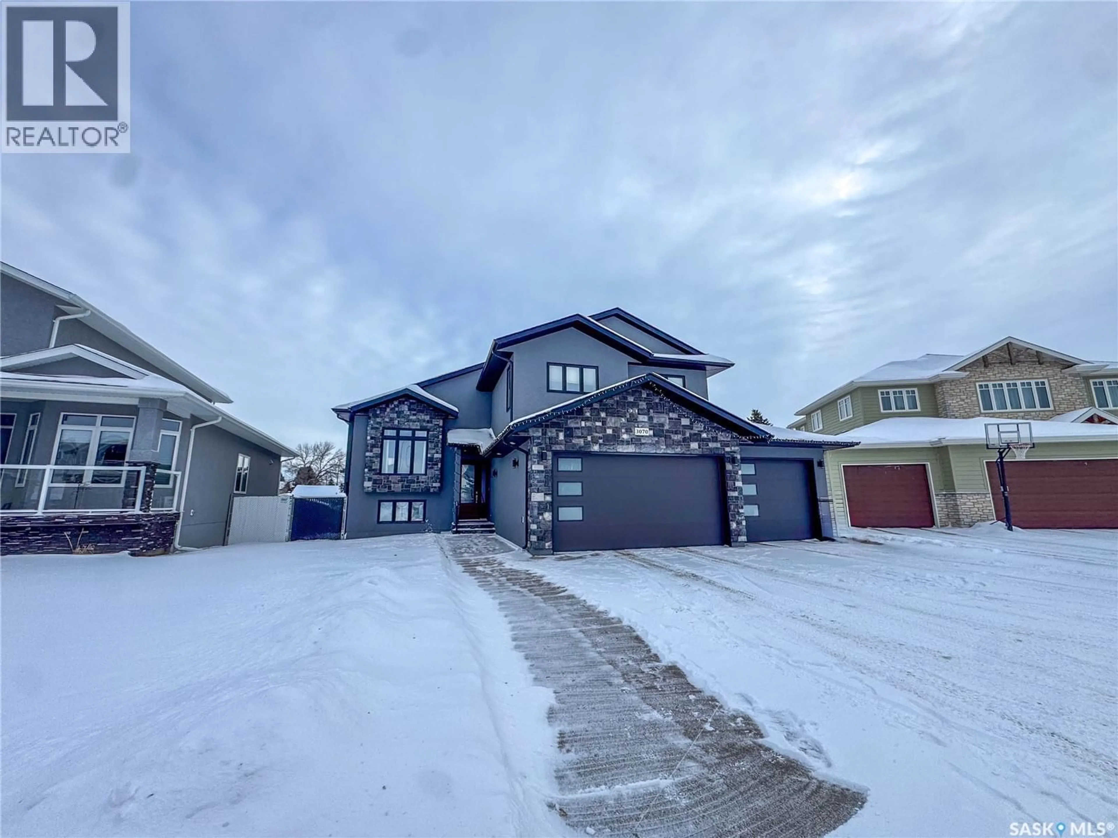 A pic from outside/outdoor area/front of a property/back of a property/a pic from drone, street for 3070 LAKEVIEW DRIVE, Prince Albert Saskatchewan S6V5E6