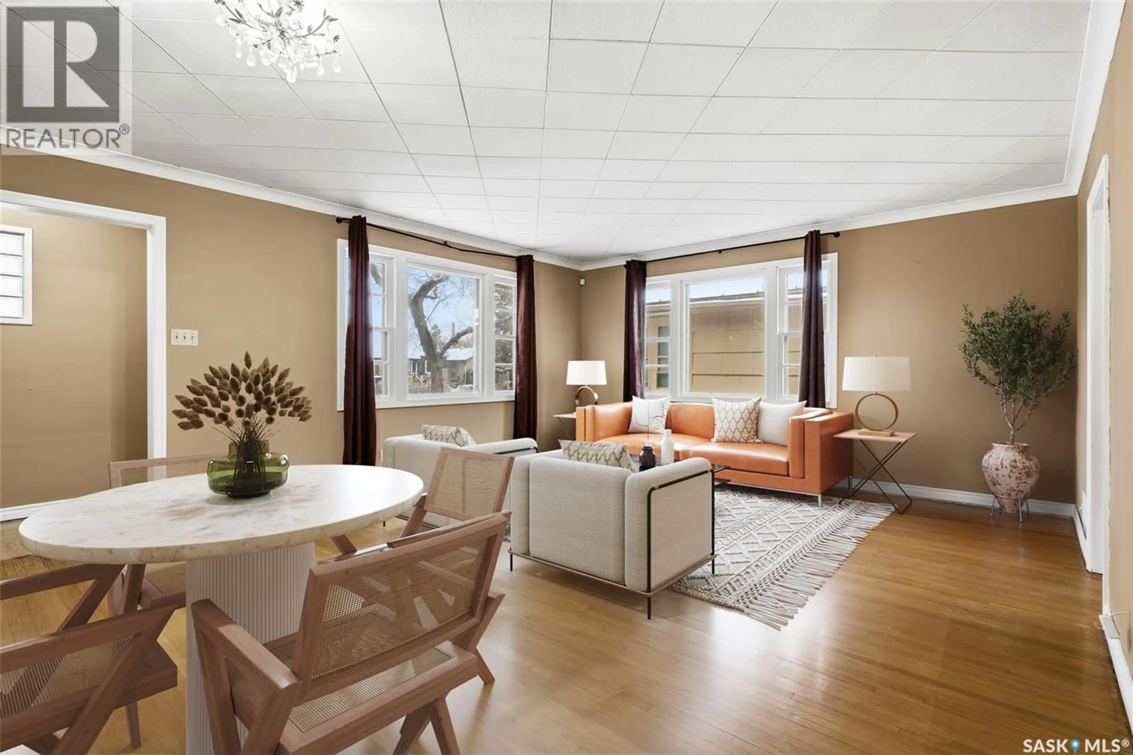 Living room with furniture, wood/laminate floor for 940 ELPHINSTONE STREET, Regina Saskatchewan S4T3L6