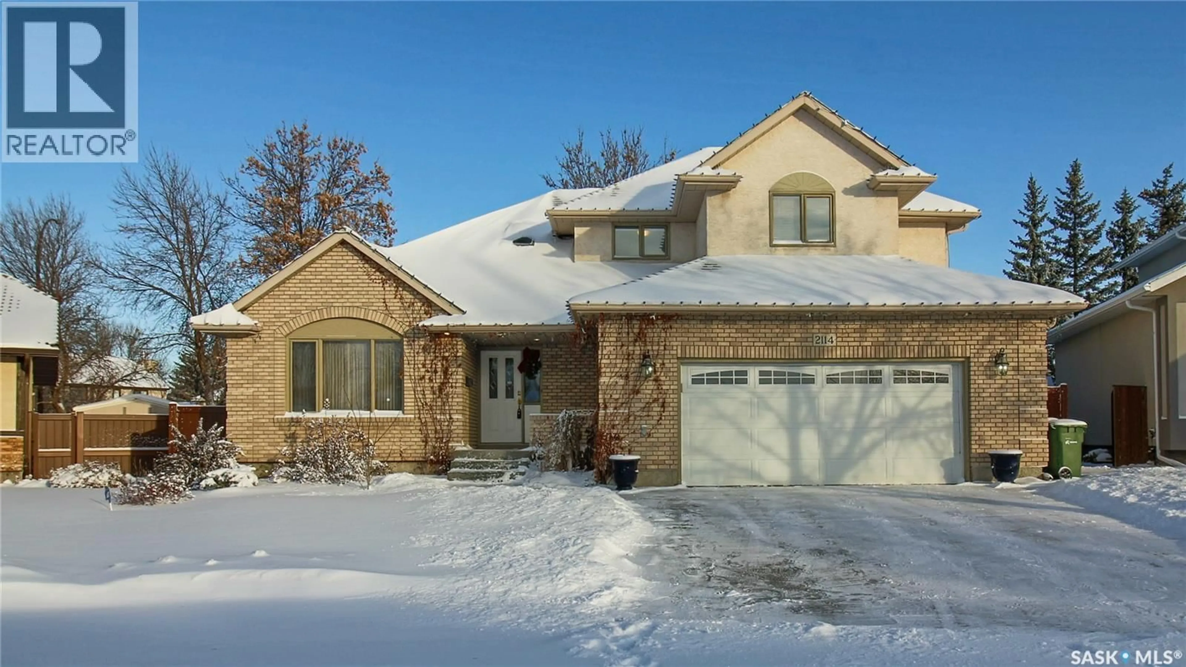 Home with brick exterior material, street for 2114 WASCANA GREENS, Regina Saskatchewan S4V2K9