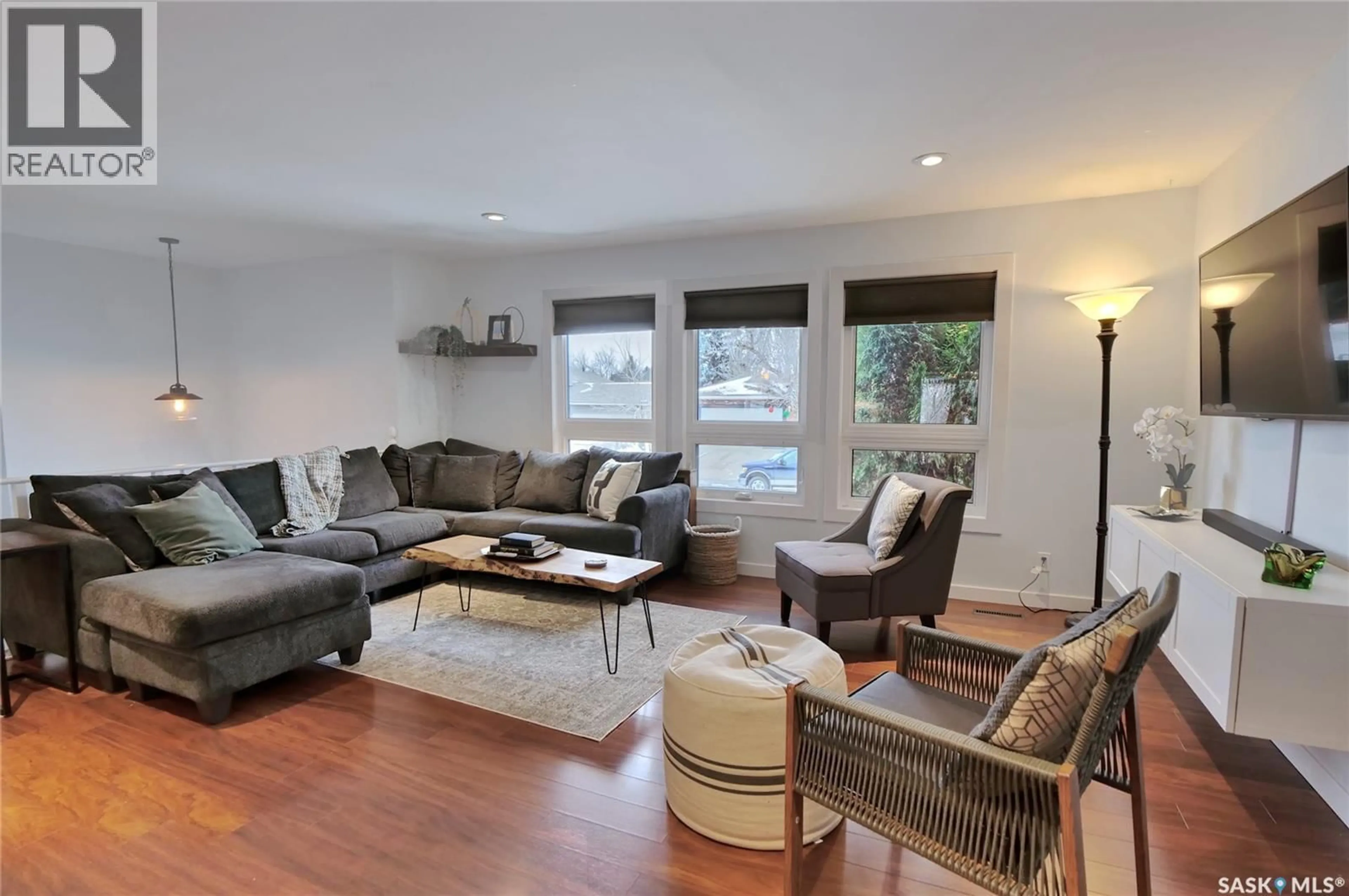 Living room with furniture, wood/laminate floor for 56 BLUEBELL CRESCENT, Moose Jaw Saskatchewan S6J1A2